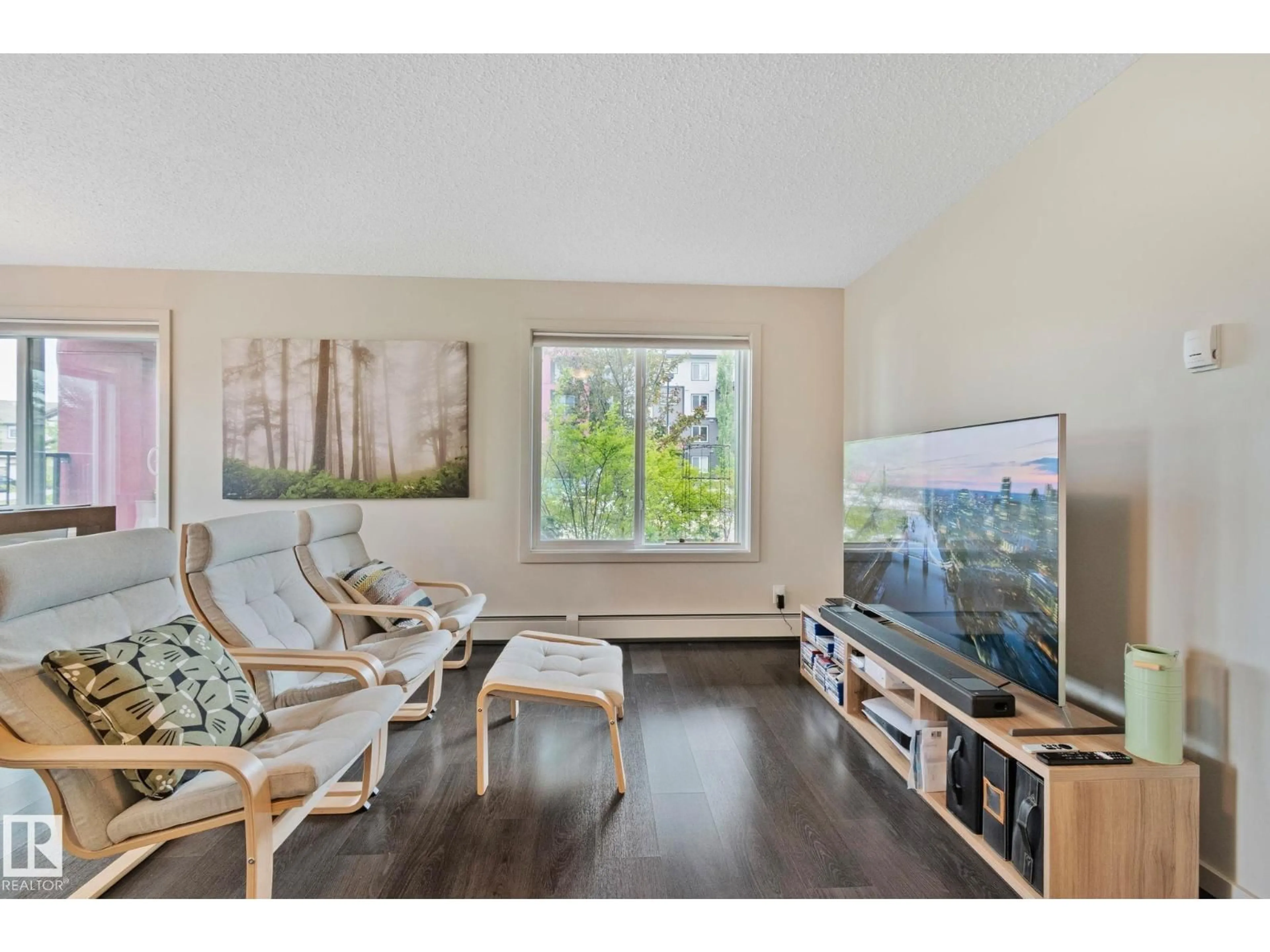 Living room with furniture, wood/laminate floor for #118 - 5521 7 AV, Edmonton Alberta T6X2A8