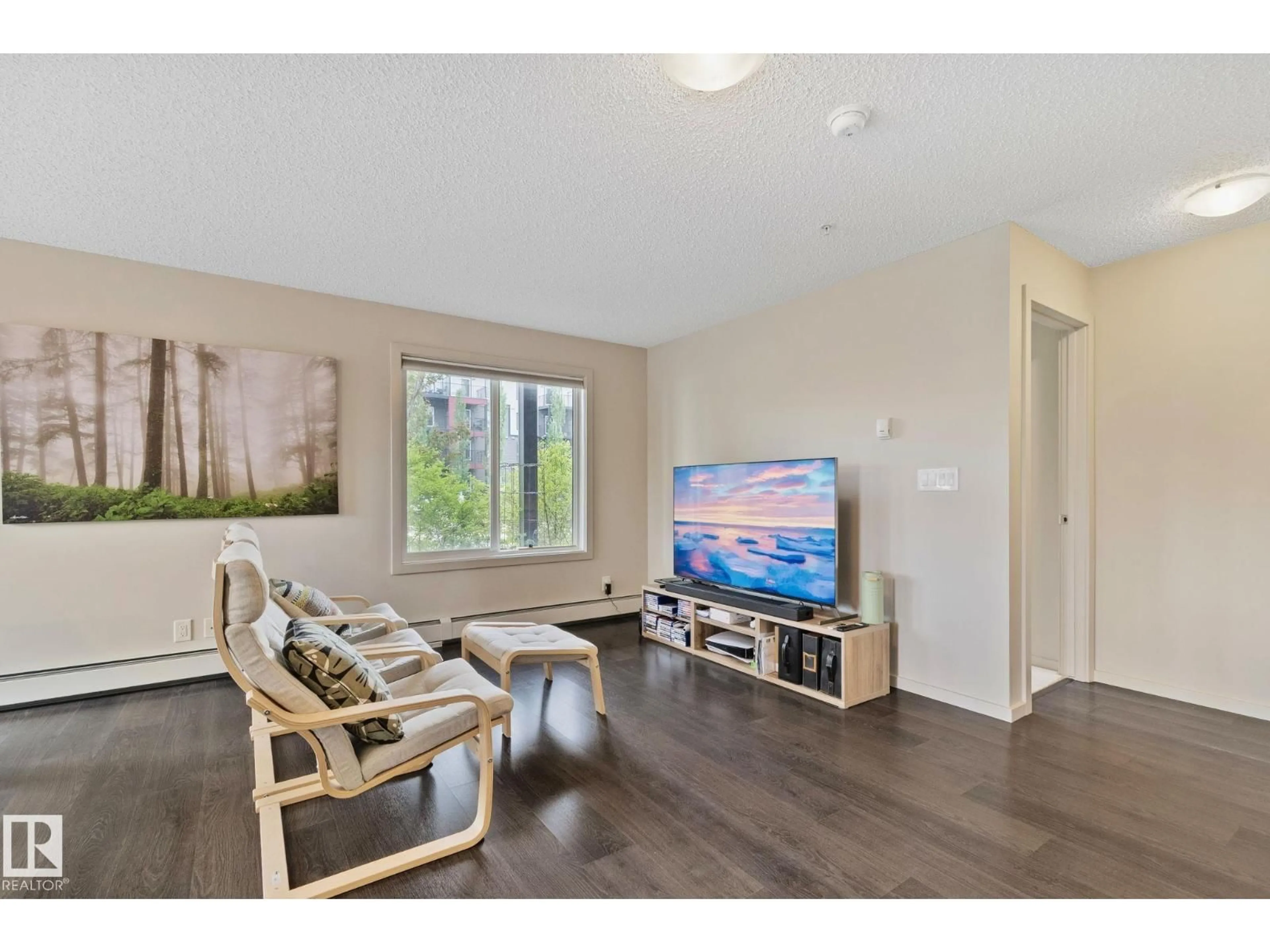 Living room with furniture, wood/laminate floor for #118 - 5521 7 AV, Edmonton Alberta T6X2A8