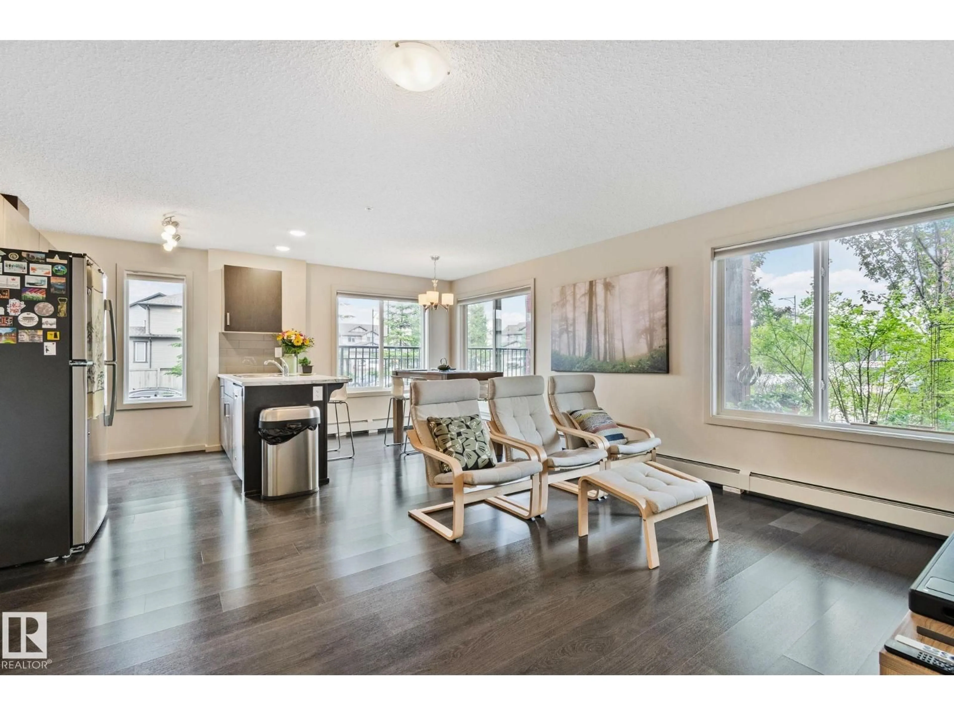 Living room with furniture, wood/laminate floor for #118 - 5521 7 AV, Edmonton Alberta T6X2A8