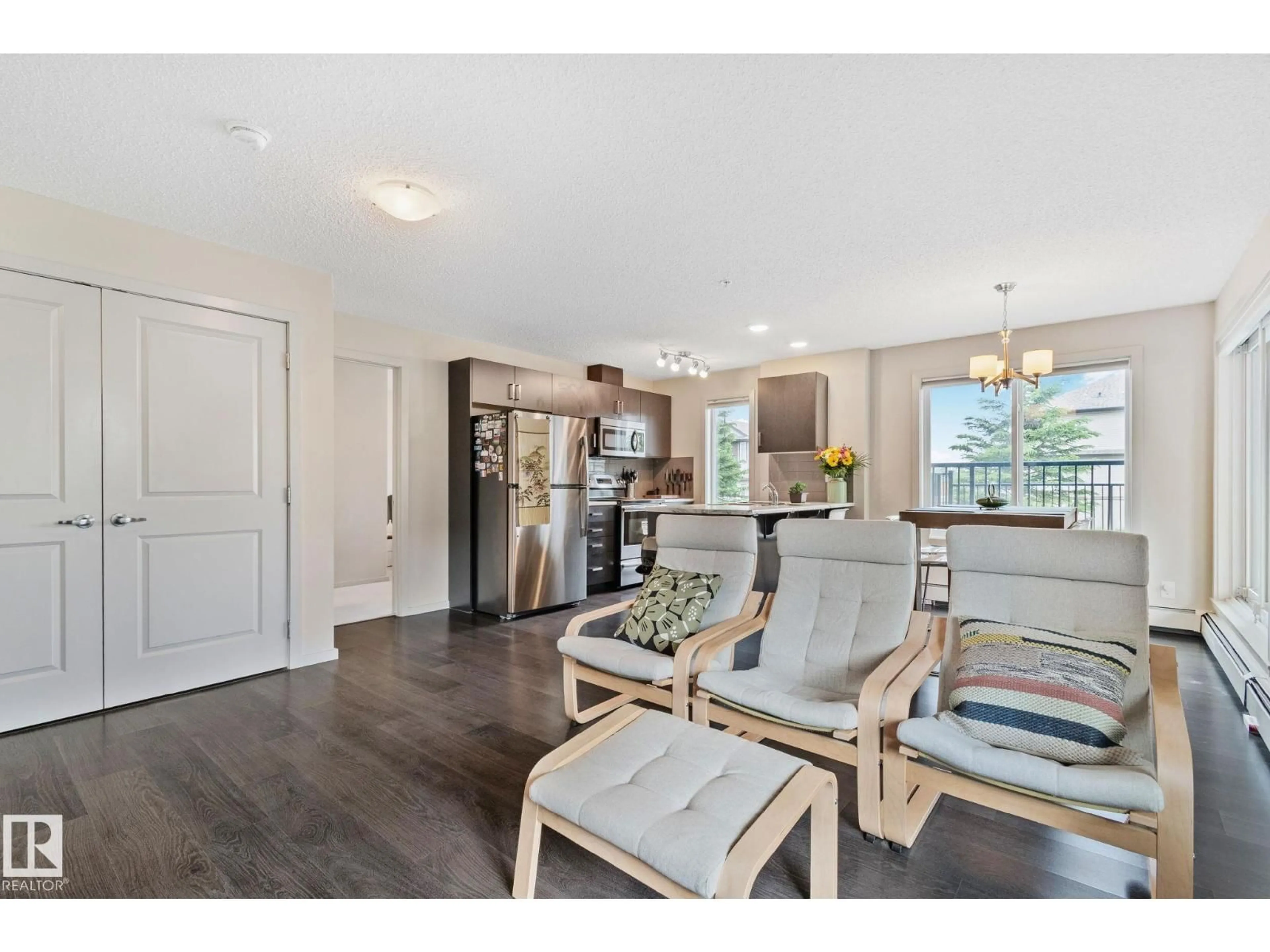 Open concept kitchen, wood/laminate floor for #118 - 5521 7 AV, Edmonton Alberta T6X2A8