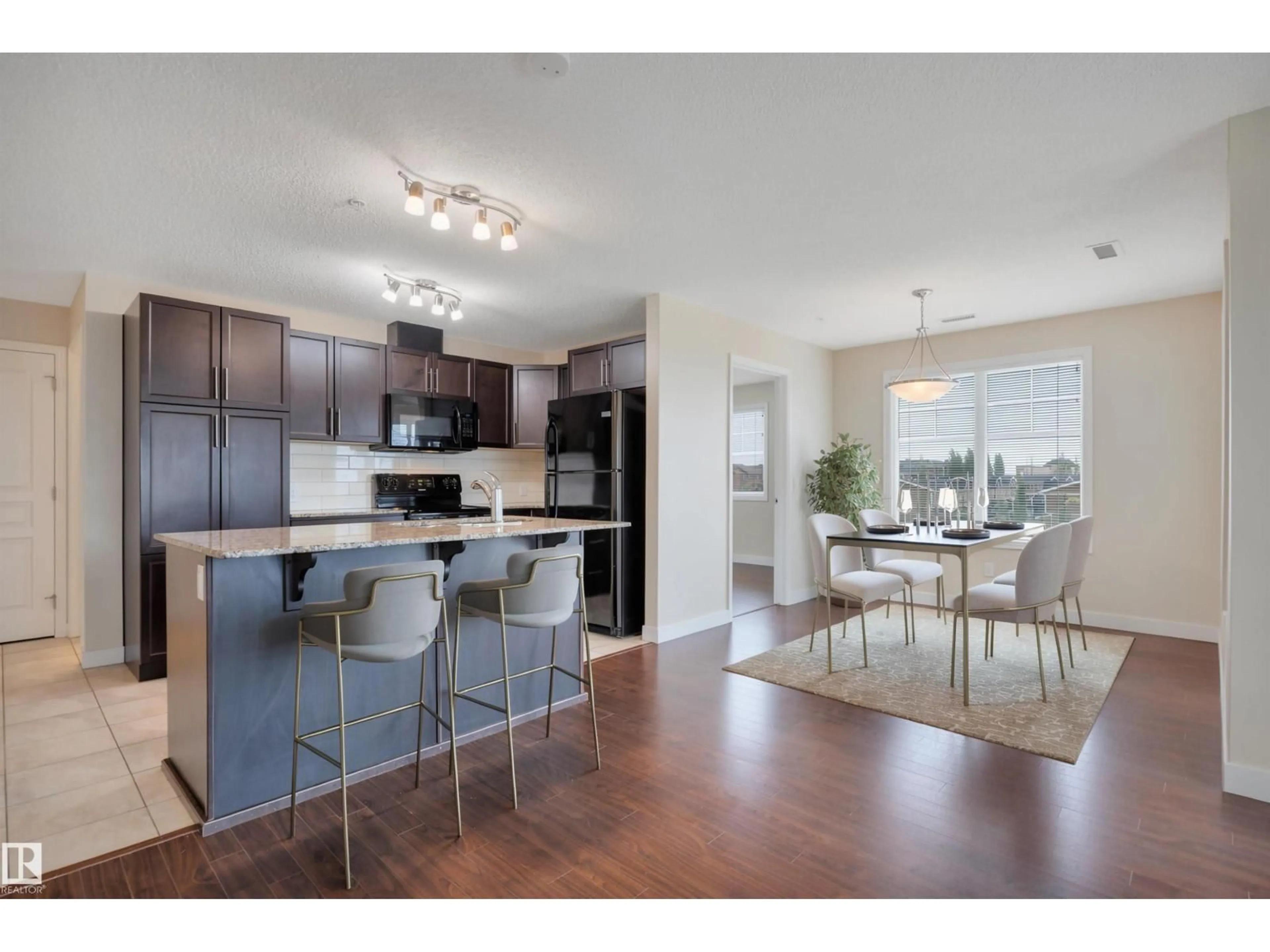 Open concept kitchen, wood/laminate floor for 3303 AUGUSTINE CR, Sherwood Park Alberta T8H0X8