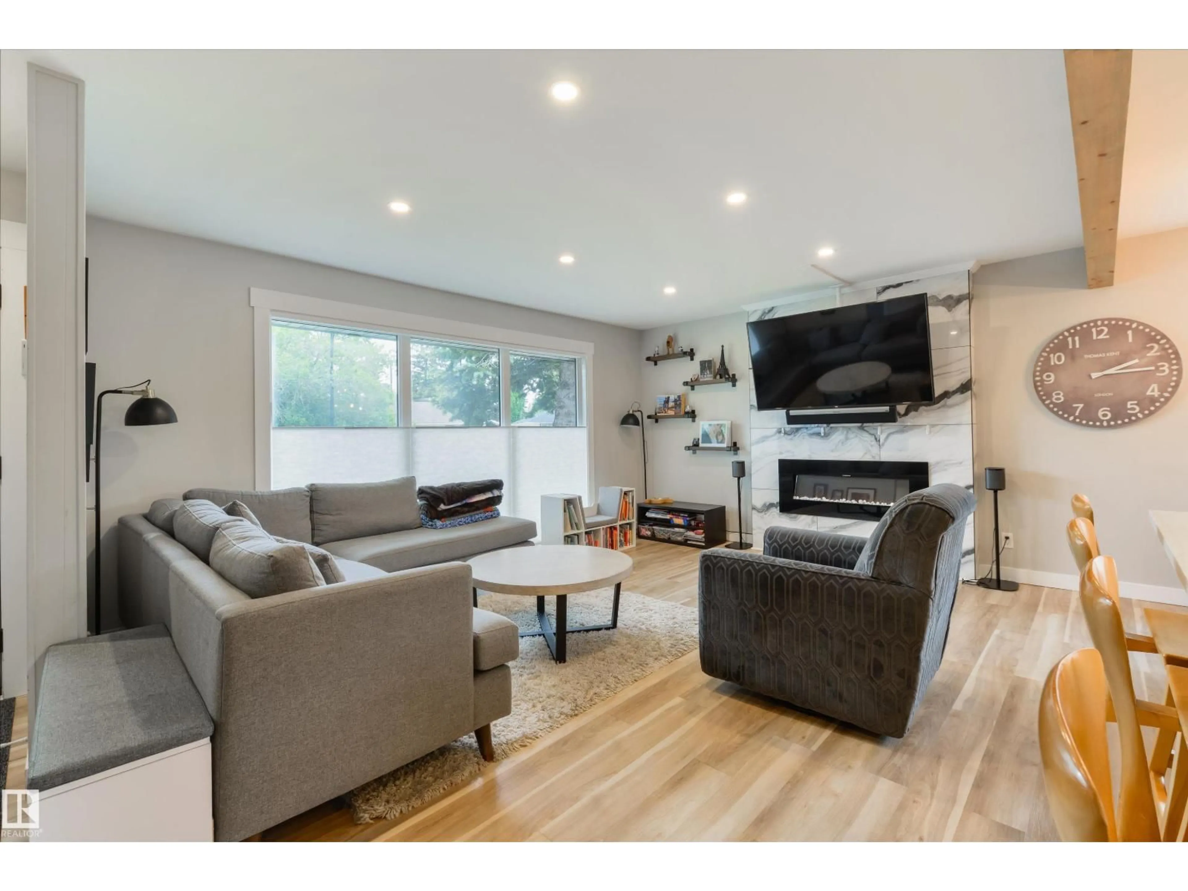 Living room with furniture, wood/laminate floor for NW - 14307 86 AV, Edmonton Alberta T5R4B4