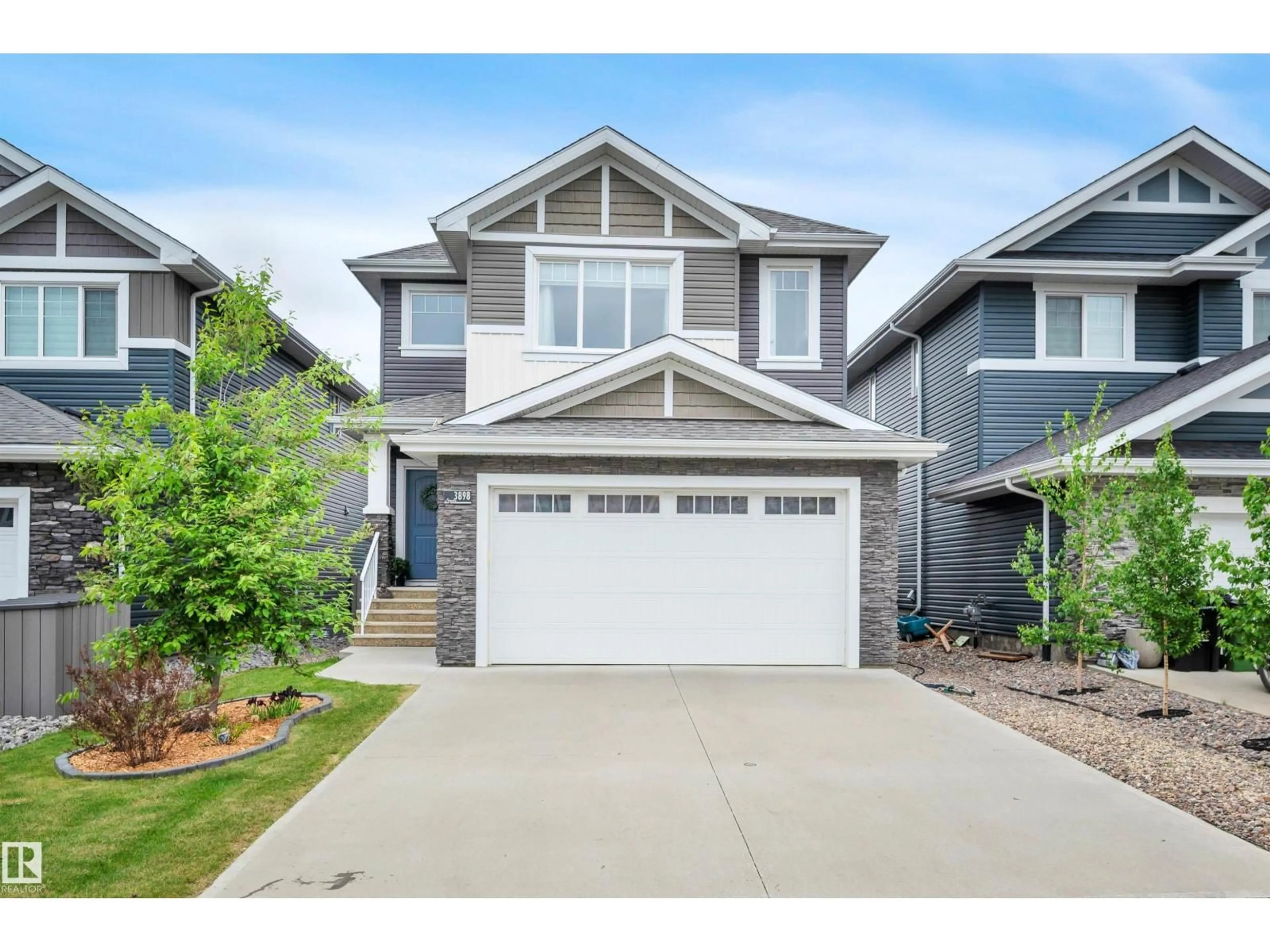 Home with vinyl exterior material, street for 3898 ROBINS CR, Edmonton Alberta T5S0M9