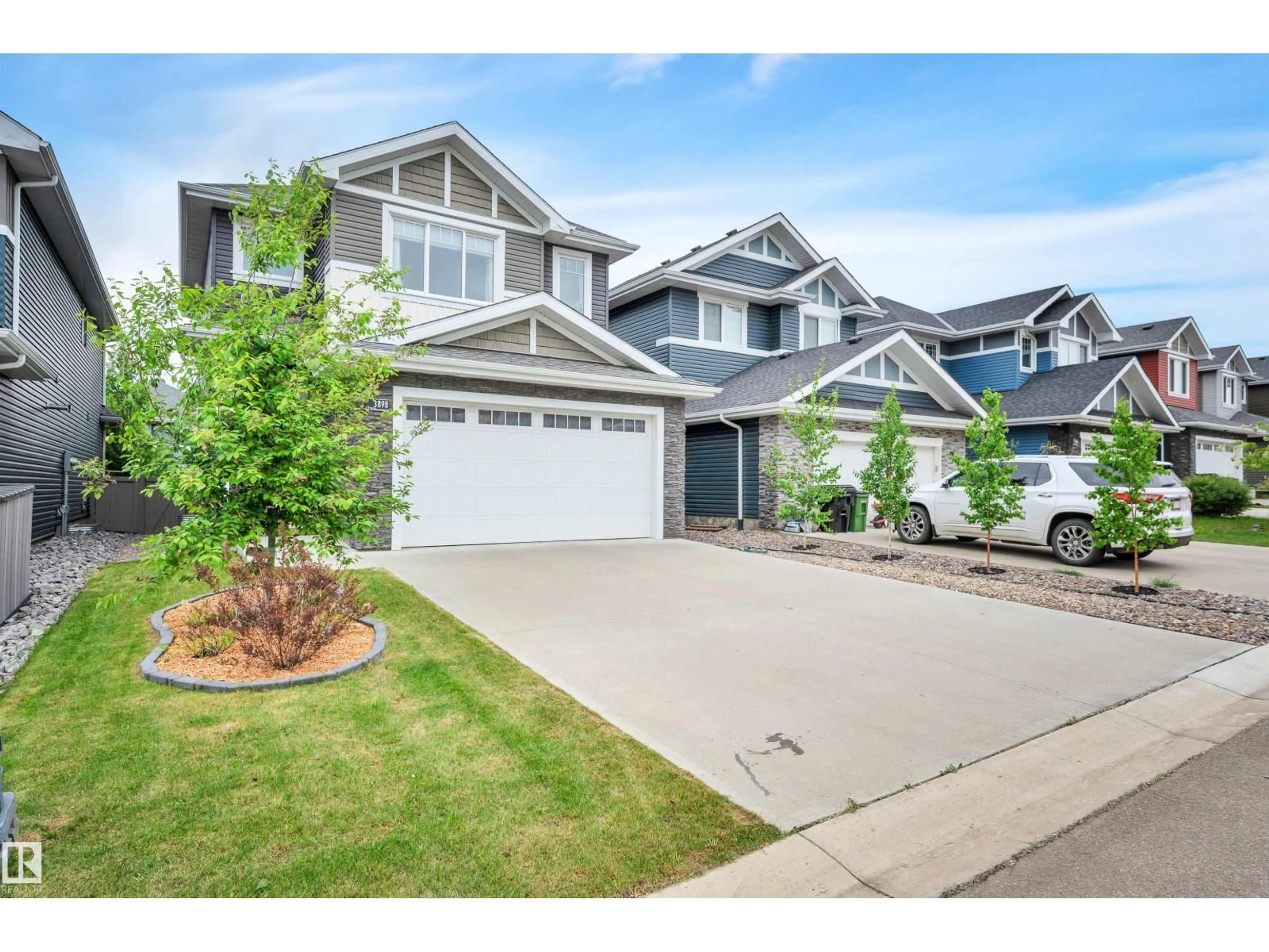 Home with vinyl exterior material, street for 3898 ROBINS CR, Edmonton Alberta T5S0M9