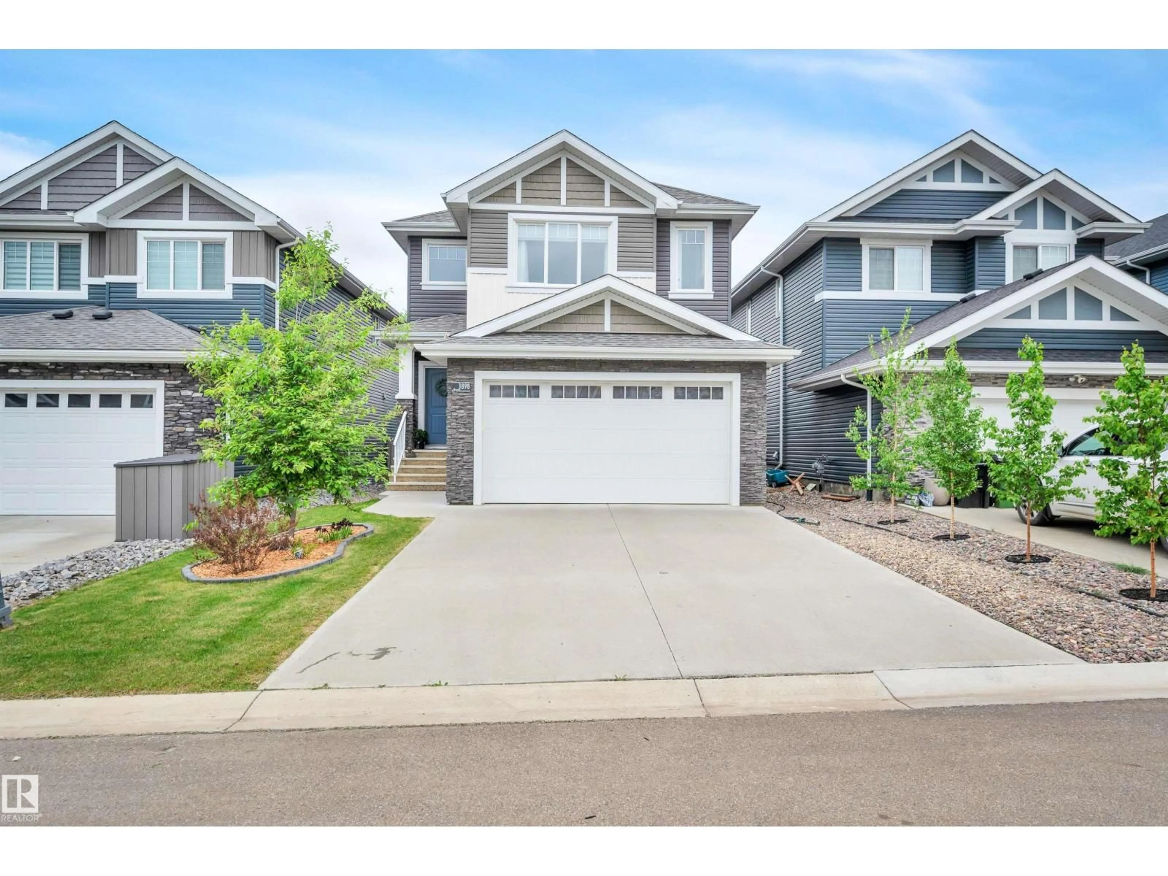 Home with vinyl exterior material, street for 3898 ROBINS CR, Edmonton Alberta T5S0M9