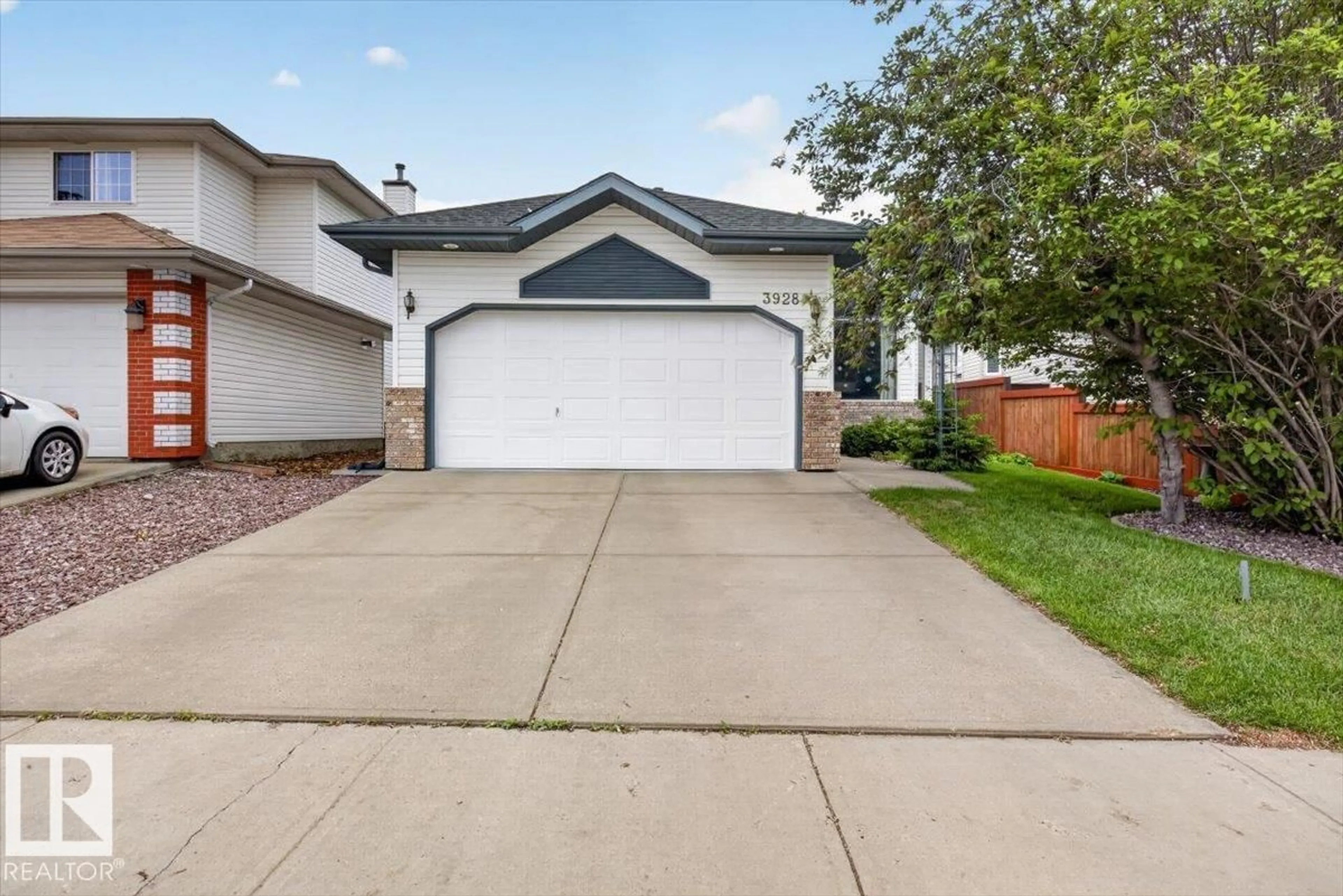 Home with vinyl exterior material, street for 3928 30 ST, Edmonton Alberta T6T1K4