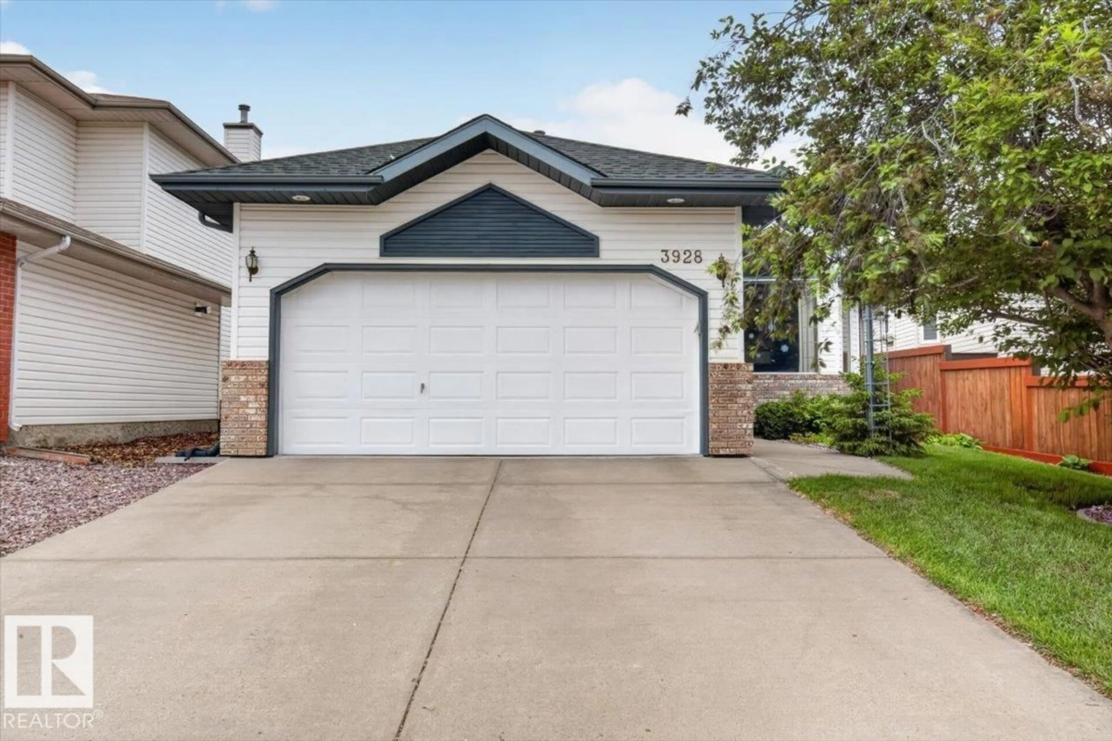 Home with vinyl exterior material, street for 3928 30 ST, Edmonton Alberta T6T1K4