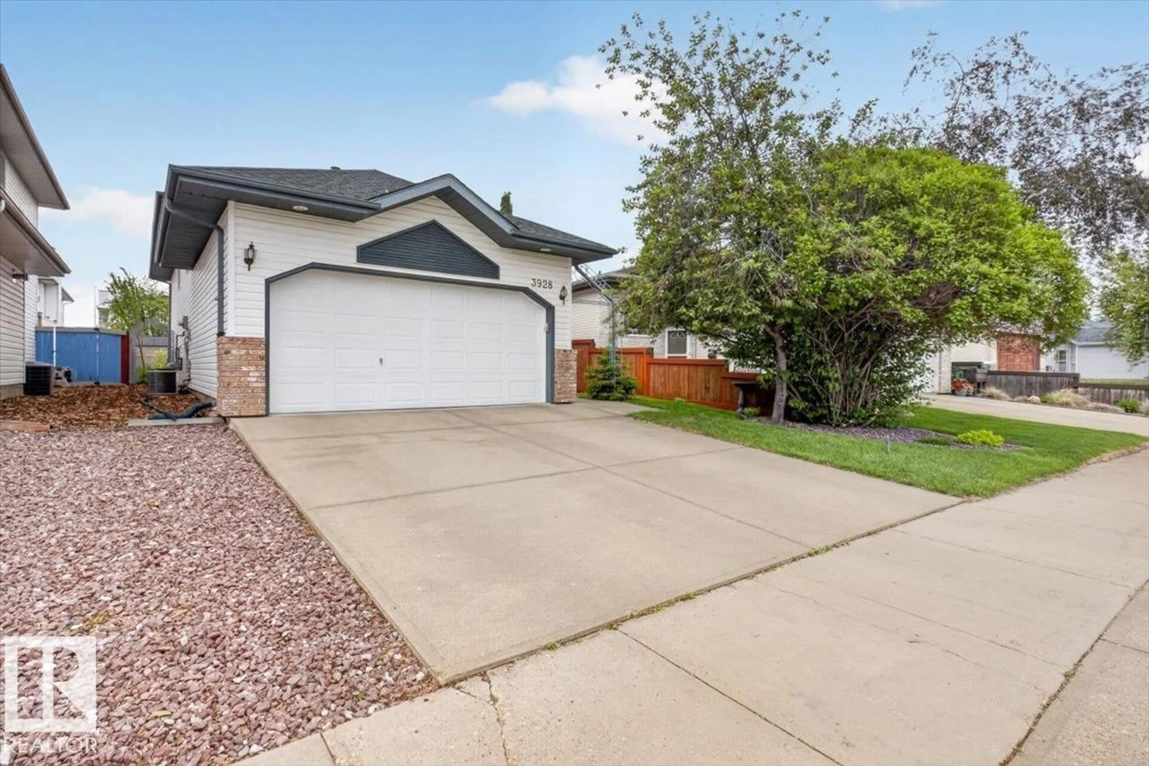 Home with vinyl exterior material, street for 3928 30 ST, Edmonton Alberta T6T1K4