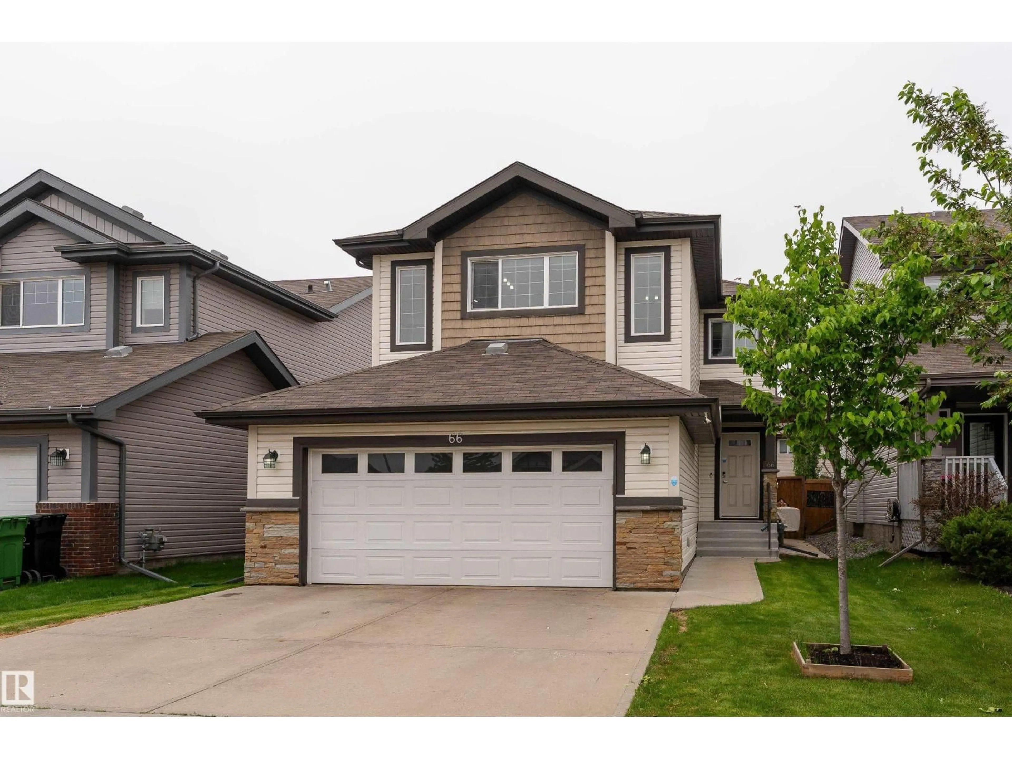 Home with vinyl exterior material, street for 66 NAVAJO LN, Fort Saskatchewan Alberta T8L0K6