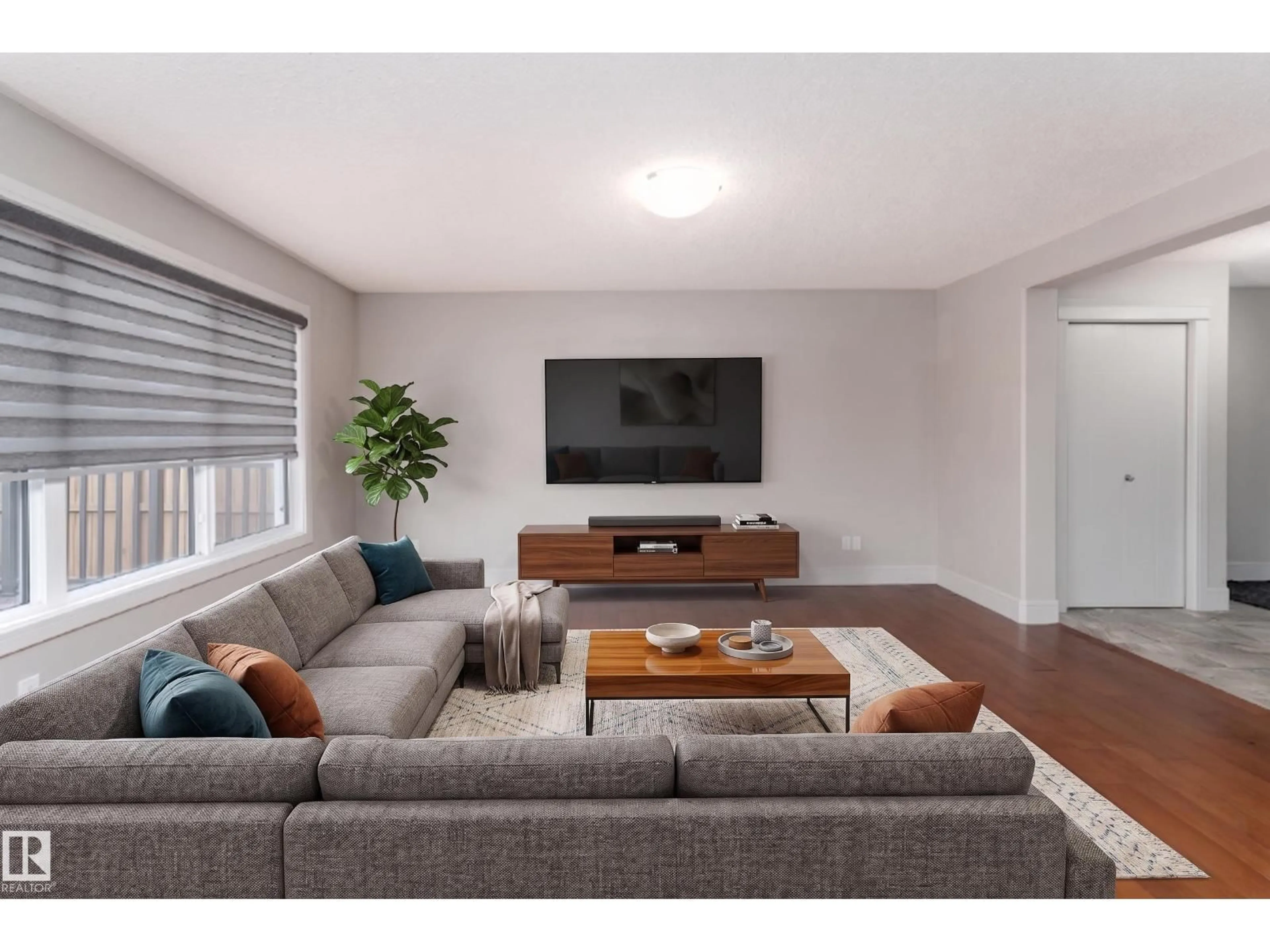 Living room with furniture, wood/laminate floor for 66 NAVAJO LN, Fort Saskatchewan Alberta T8L0K6