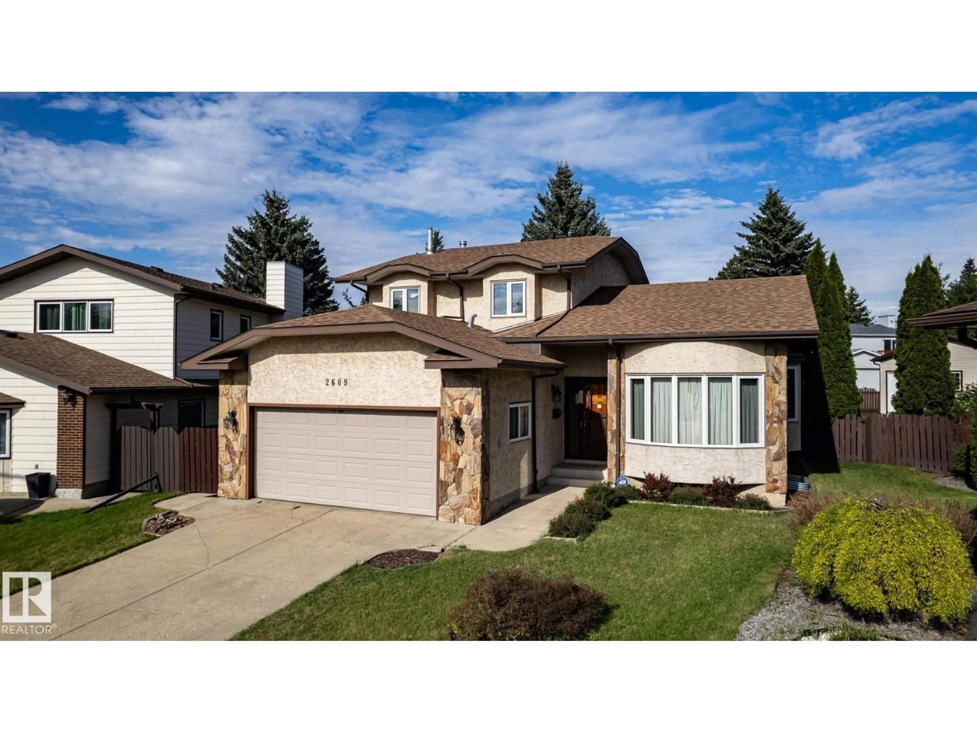 Home with vinyl exterior material, street for 2609 49 ST, Edmonton Alberta T6L3W8