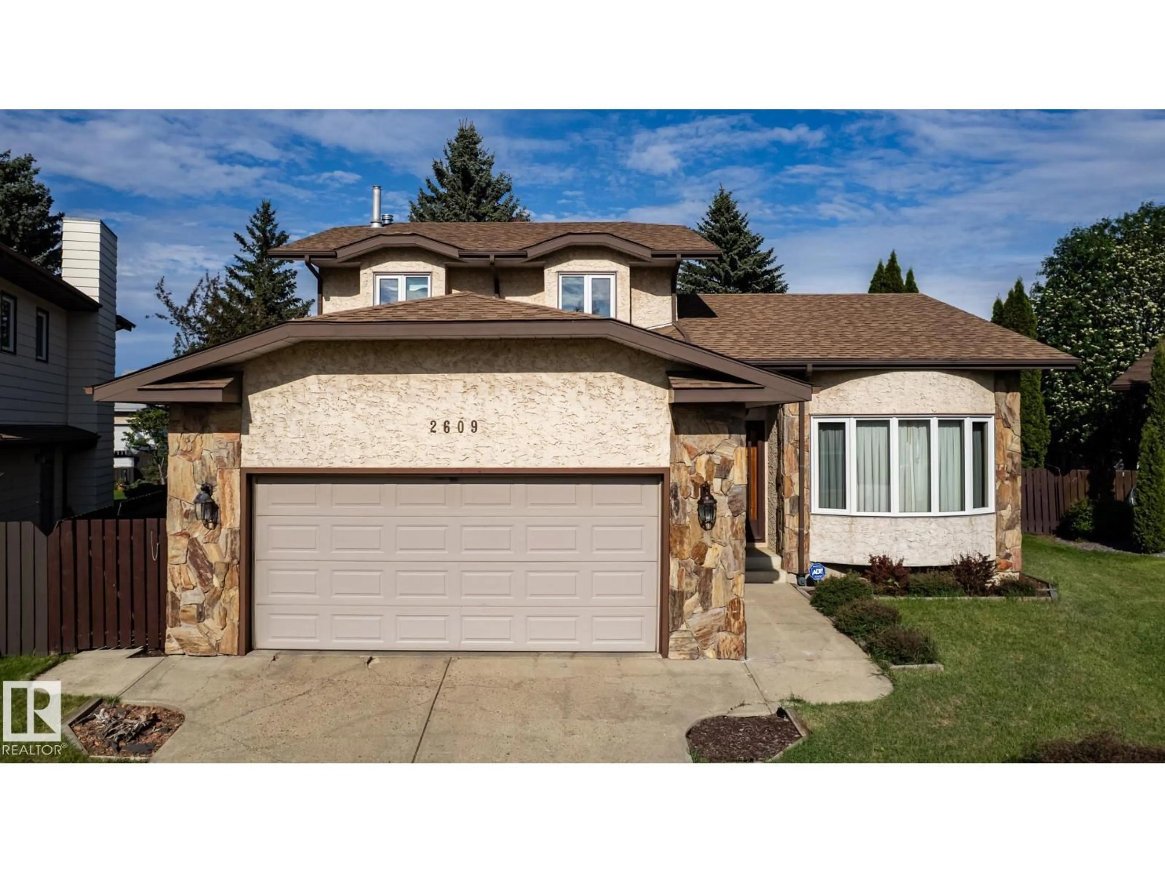 Home with vinyl exterior material, street for 2609 49 ST, Edmonton Alberta T6L3W8