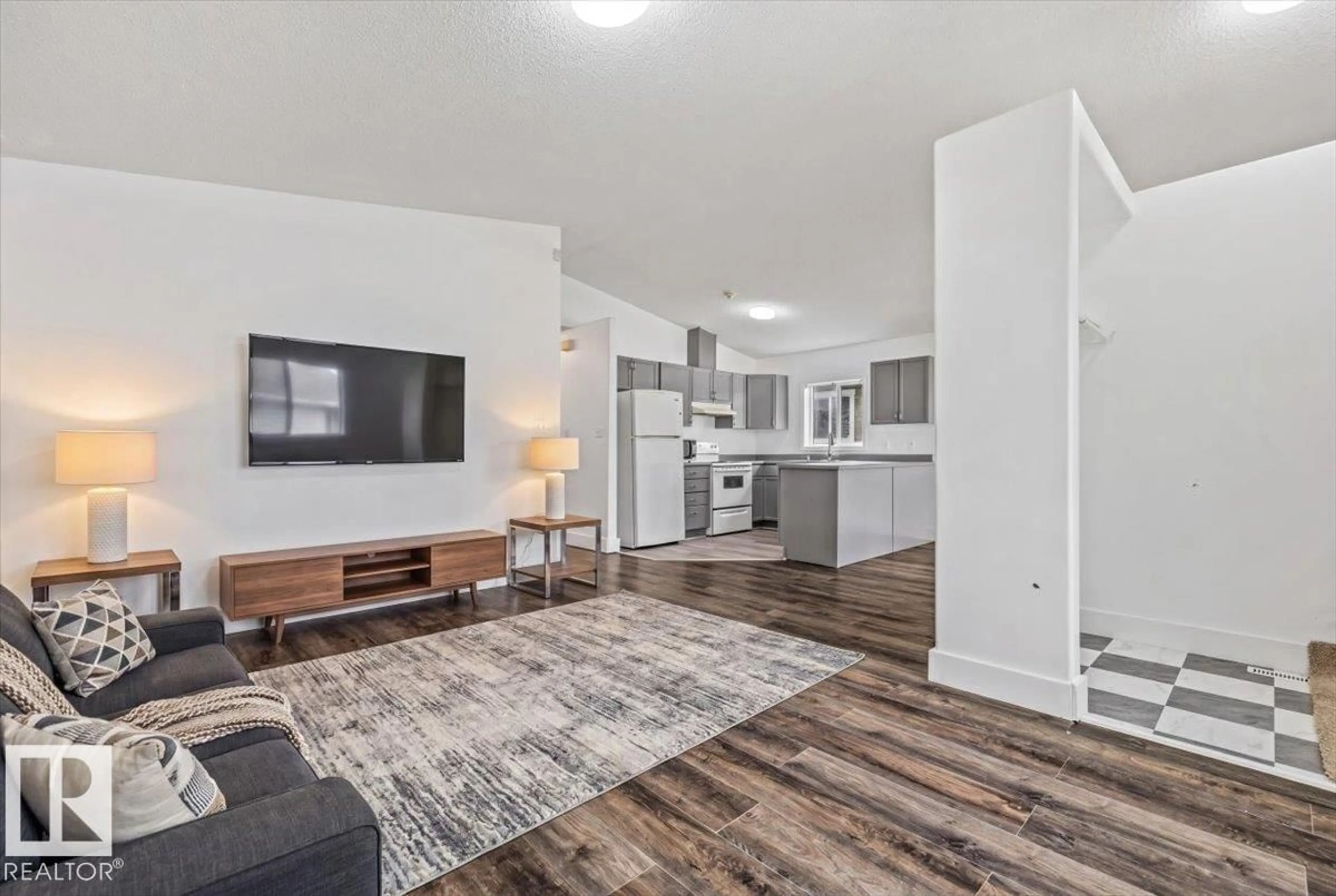 Living room with furniture, wood/laminate floor for NW - 11229 85 ST, Edmonton Alberta T5B3C6