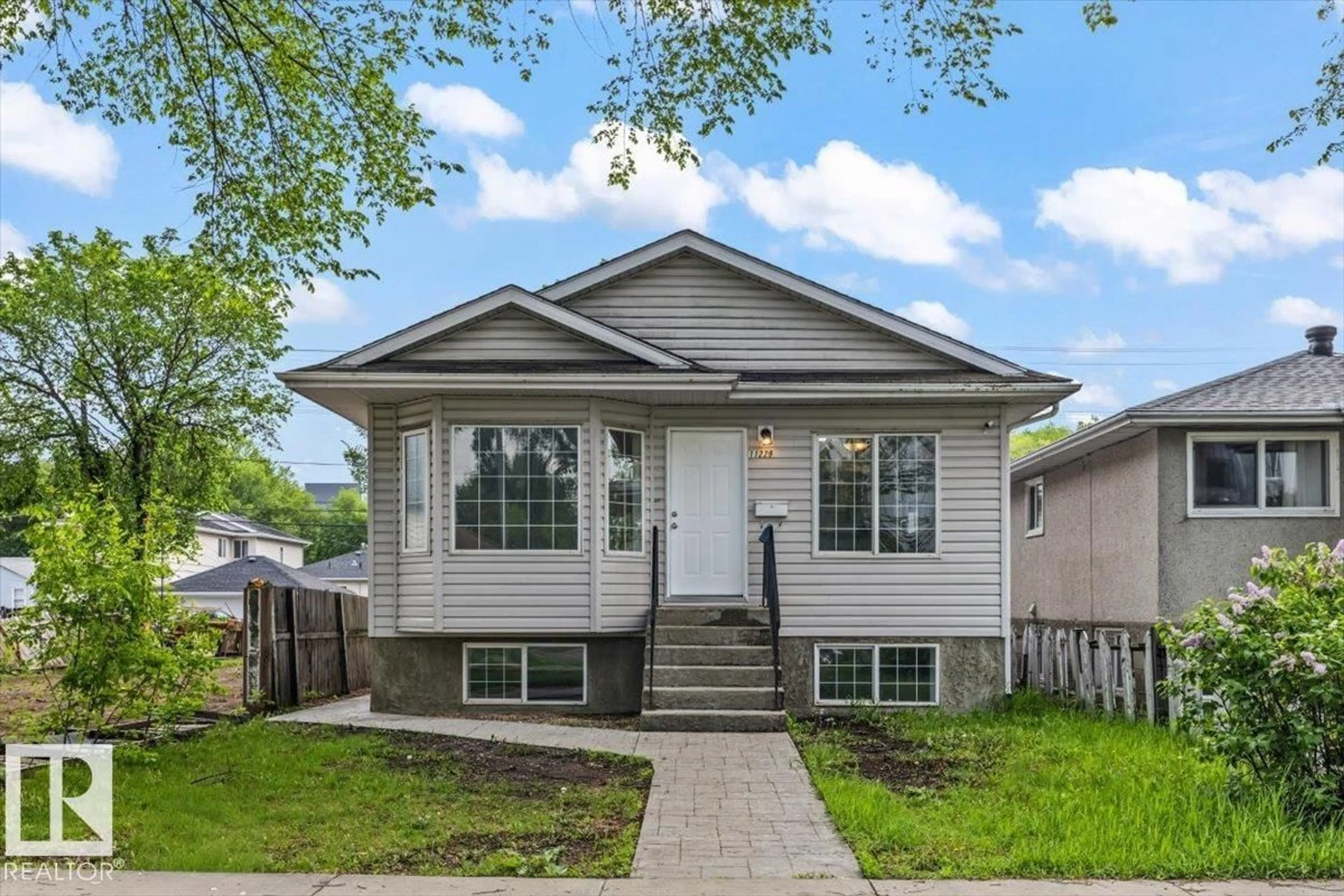 Home with vinyl exterior material, street for NW - 11229 85 ST, Edmonton Alberta T5B3C6