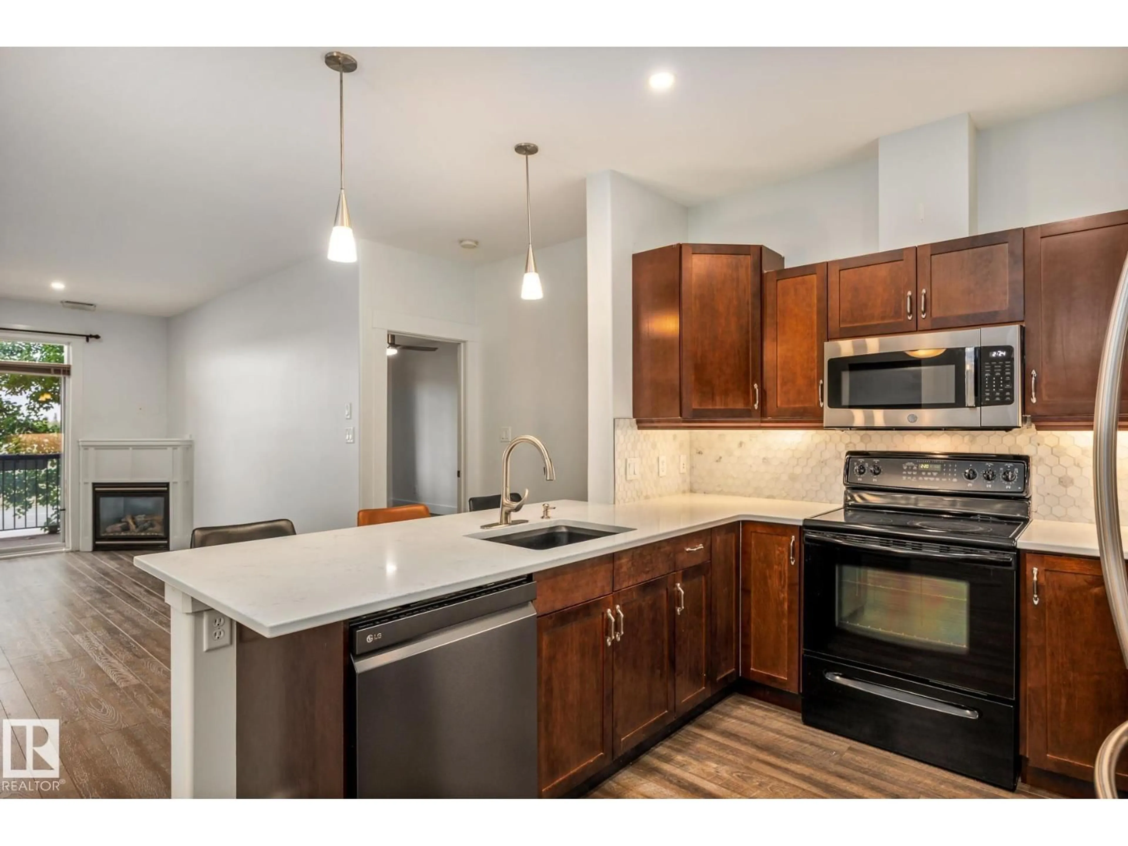 Open concept kitchen, unknown for #217 - 2503 HANNA CR, Edmonton Alberta T6R0H1