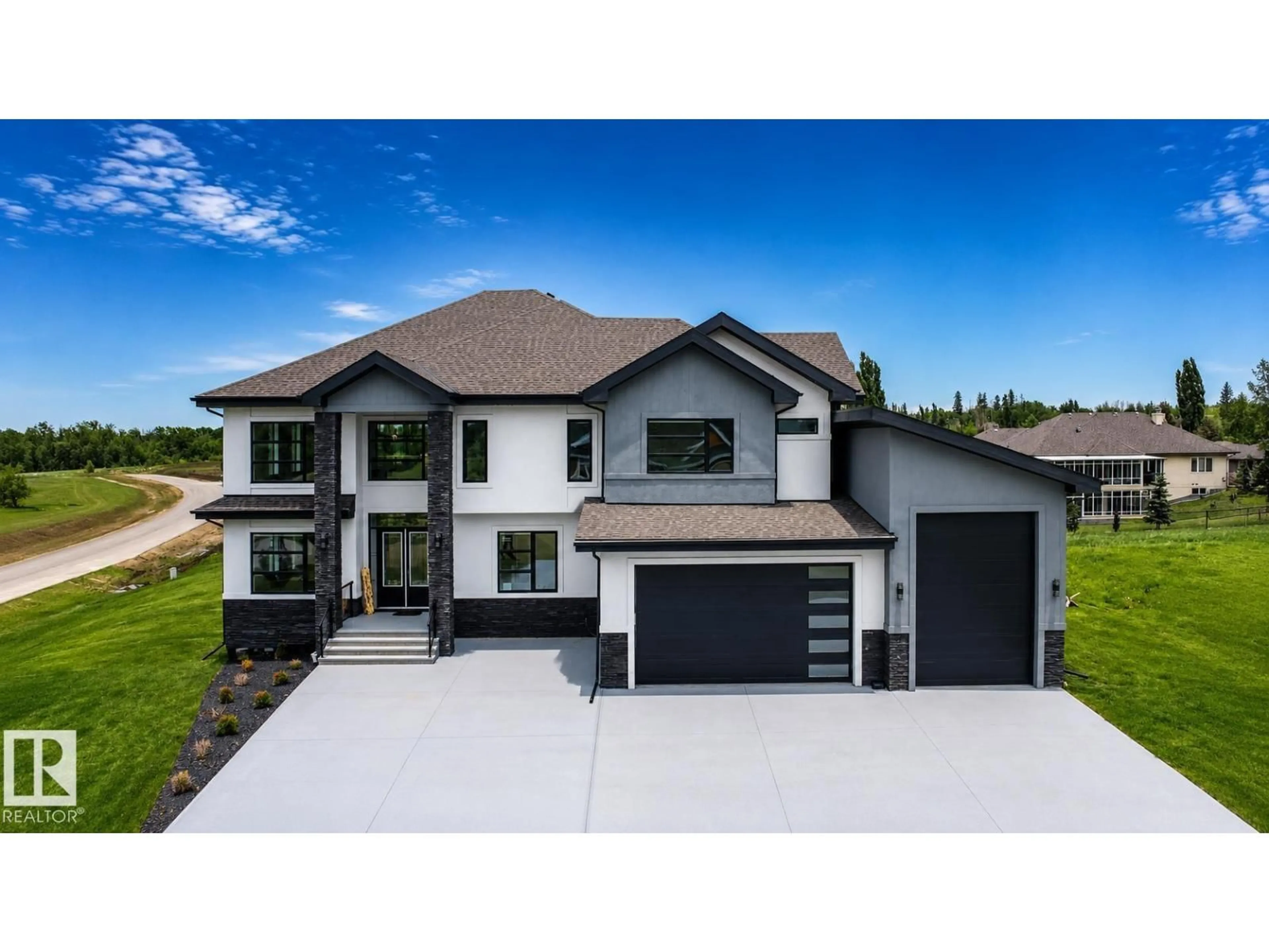 Home with vinyl exterior material, street for #83 - 26131 TWP ROAD 532 A, Rural Parkland County Alberta T7Y1A1