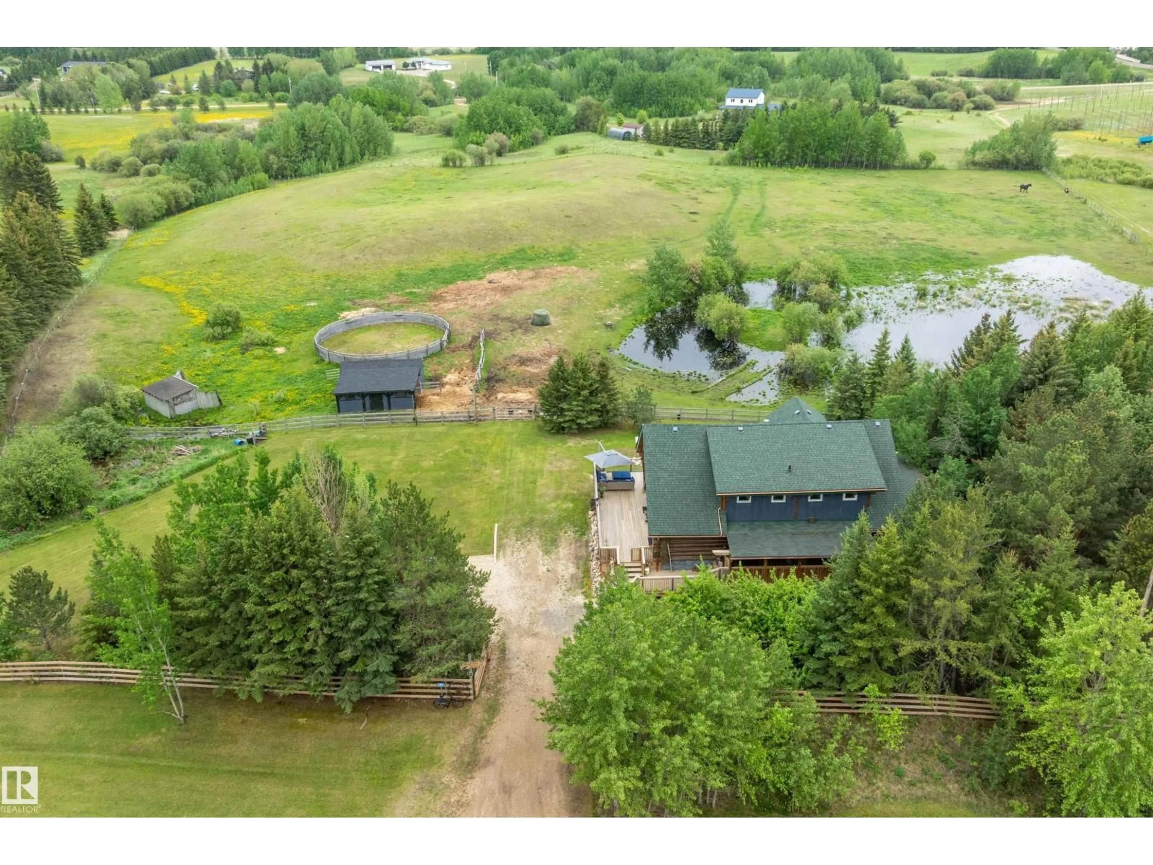 A pic from outside/outdoor area/front of a property/back of a property/a pic from drone, water/lake/river/ocean view for 50251 - 280 RANGE ROAD 234, Rural Leduc County Alberta T4X0L6