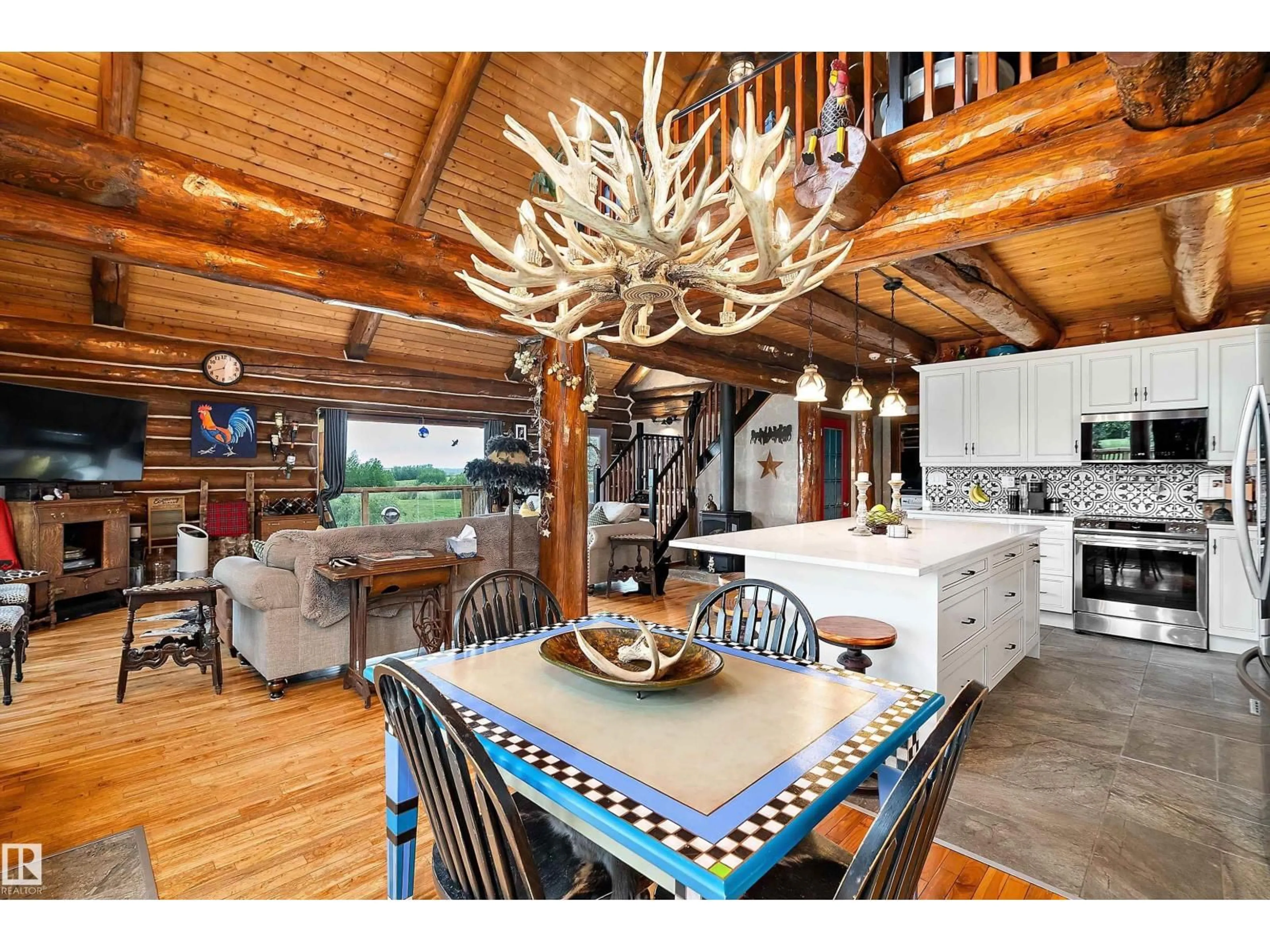 Rustic kitchen, wood/laminate floor for 50251 - 280 RANGE ROAD 234, Rural Leduc County Alberta T4X0L6