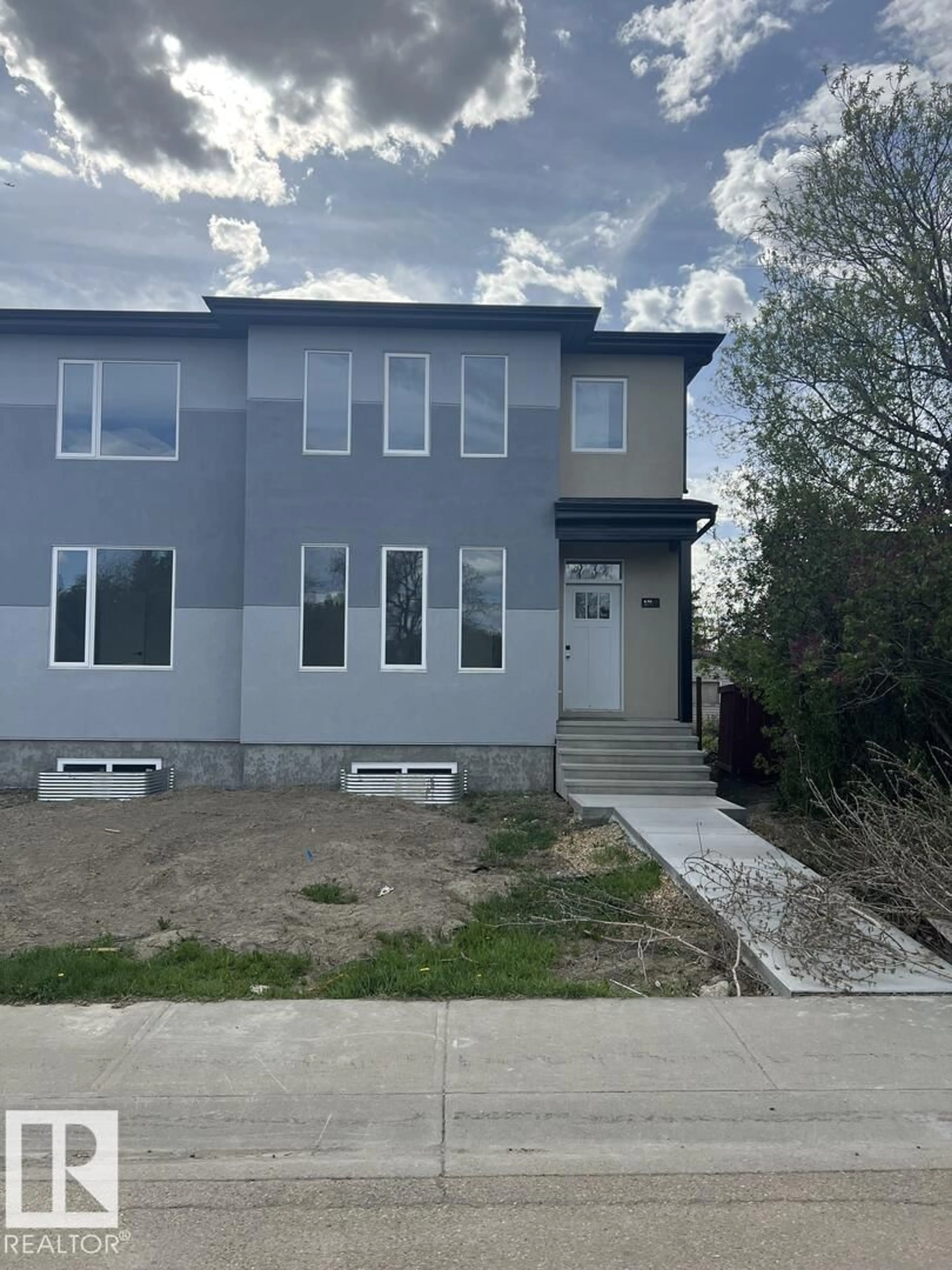 Home with vinyl exterior material, street for NW - 10508 162 ST, Edmonton Alberta T5P3M5