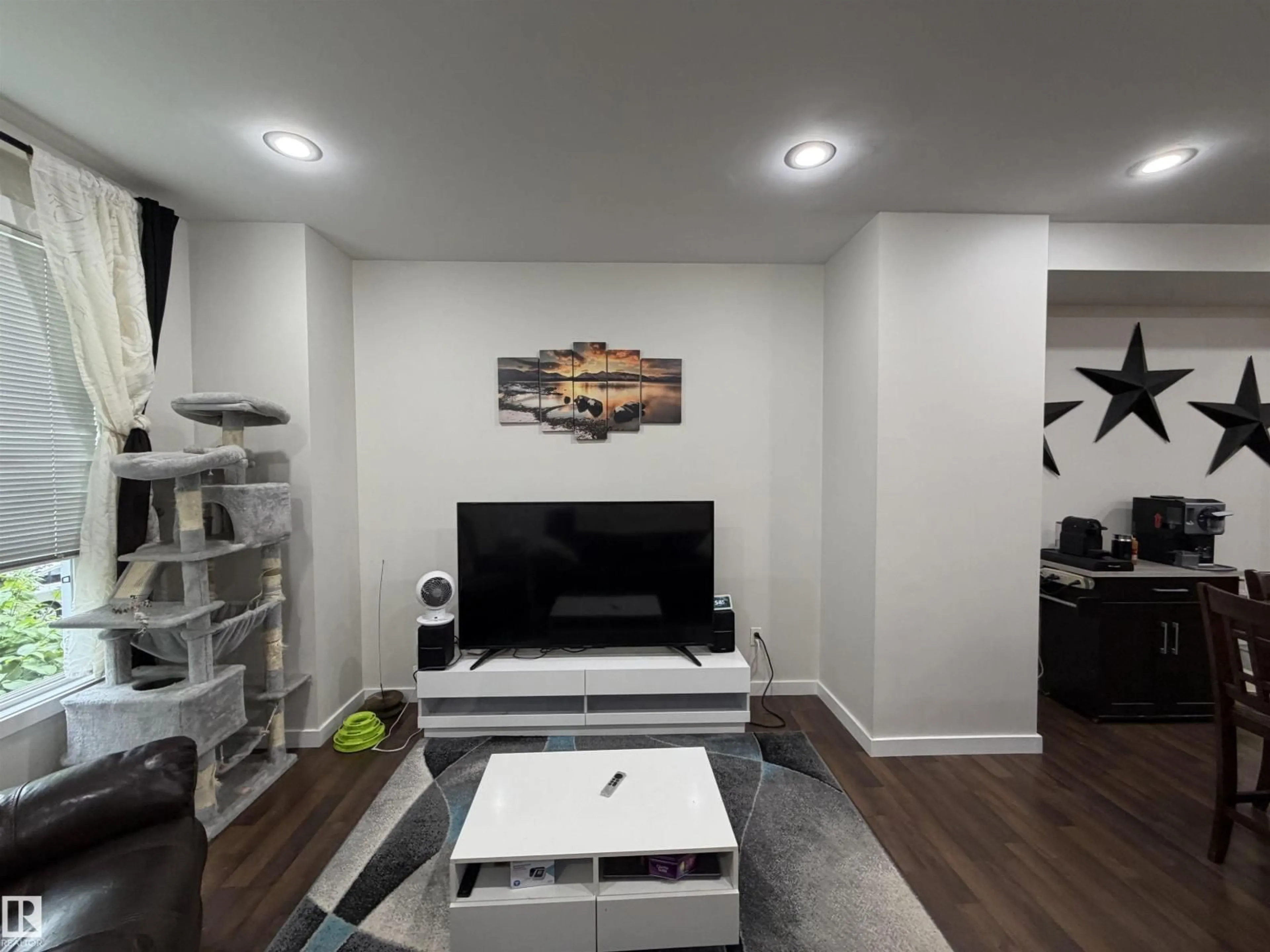 Living room with furniture, wood/laminate floor for #45 - 6075 SCHONSEE WY, Edmonton Alberta T5Z0H4