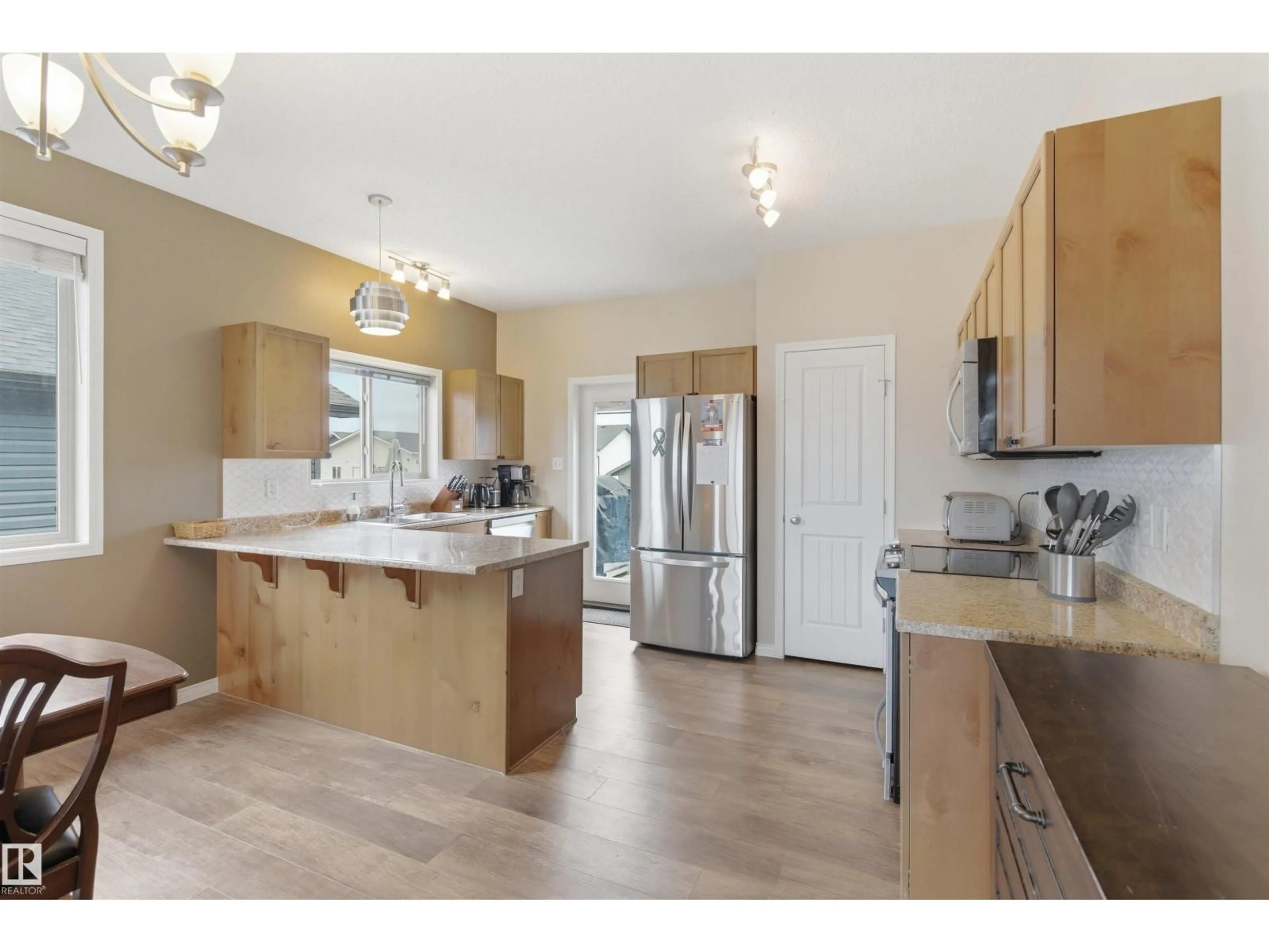 Open concept kitchen, wood/laminate floor for 4923 58 AV, Cold Lake Alberta T9M0E7