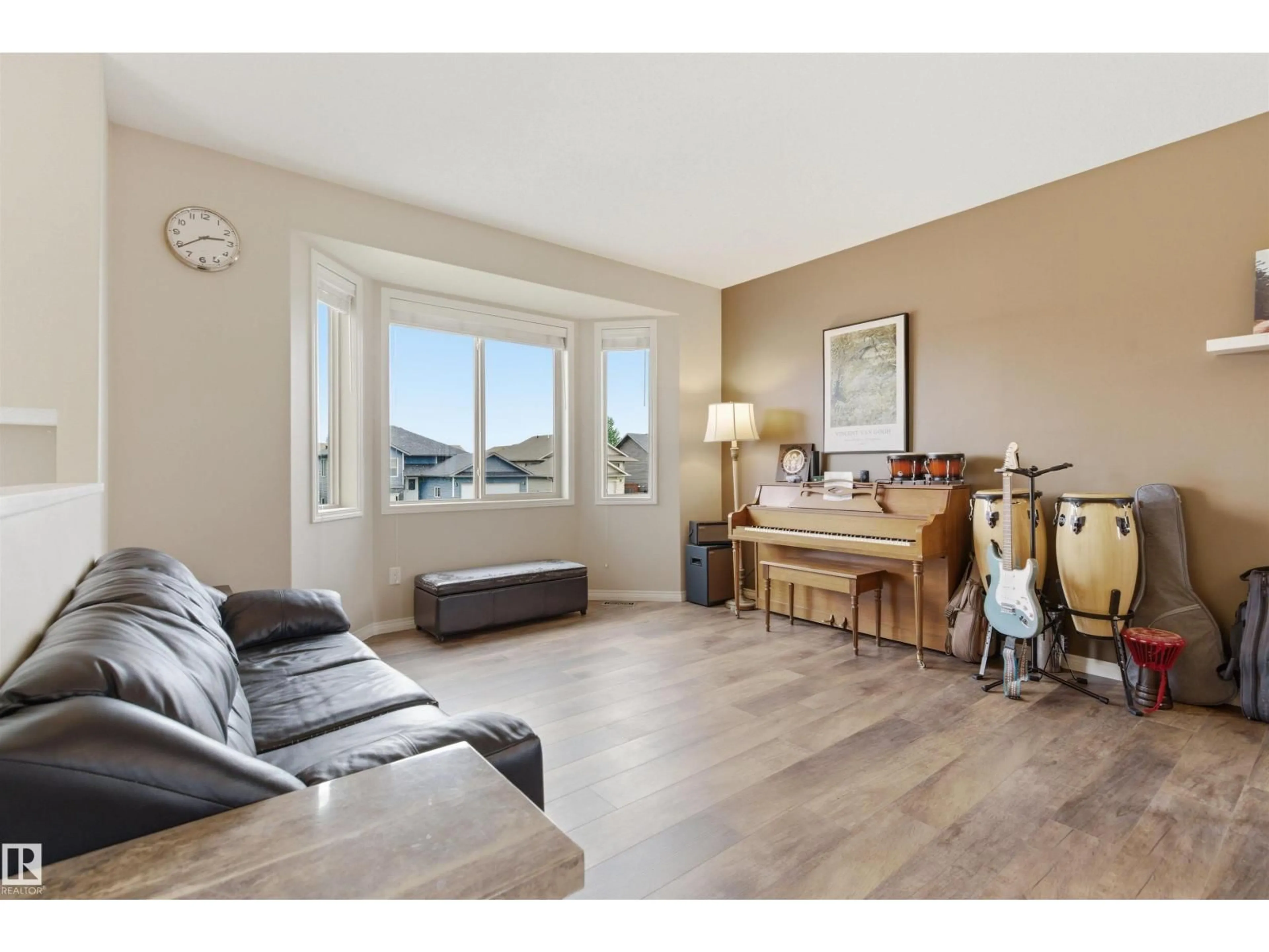Living room with furniture, wood/laminate floor for 4923 58 AV, Cold Lake Alberta T9M0E7