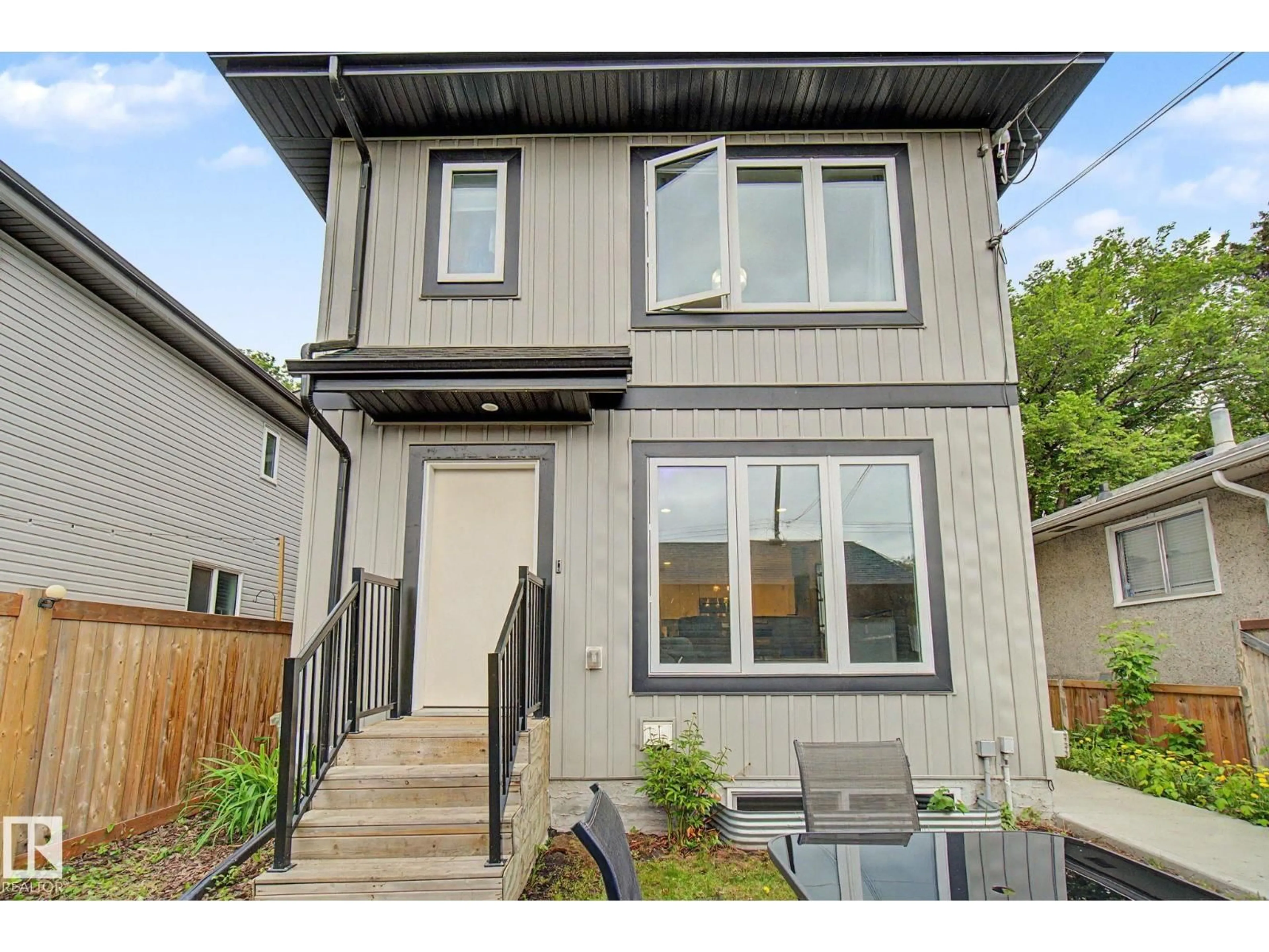 Home with vinyl exterior material, street for NW - 12035 93 ST, Edmonton Alberta T5G1E7