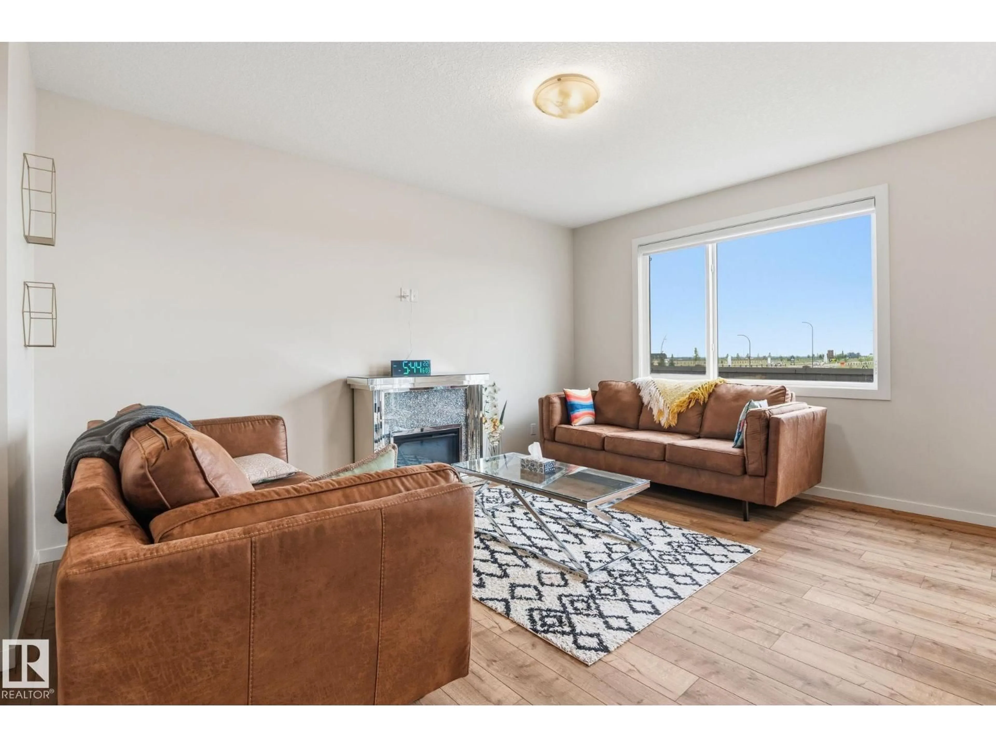 Living room with furniture, wood/laminate floor for 20011 26 NW, Edmonton Alberta T6M1K3