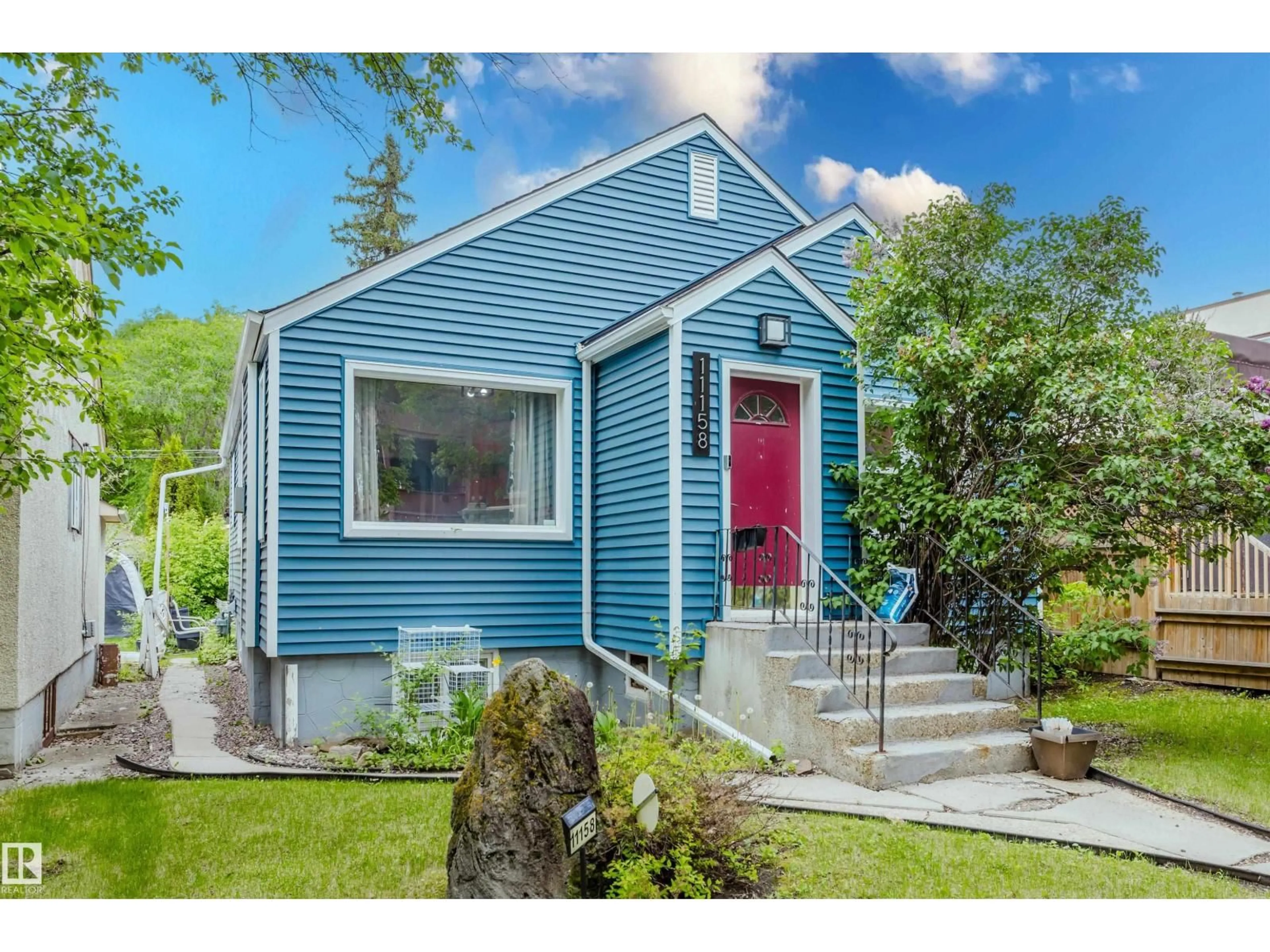 Home with vinyl exterior material, street for NW - 11158 65 ST, Edmonton Alberta T5W4K1
