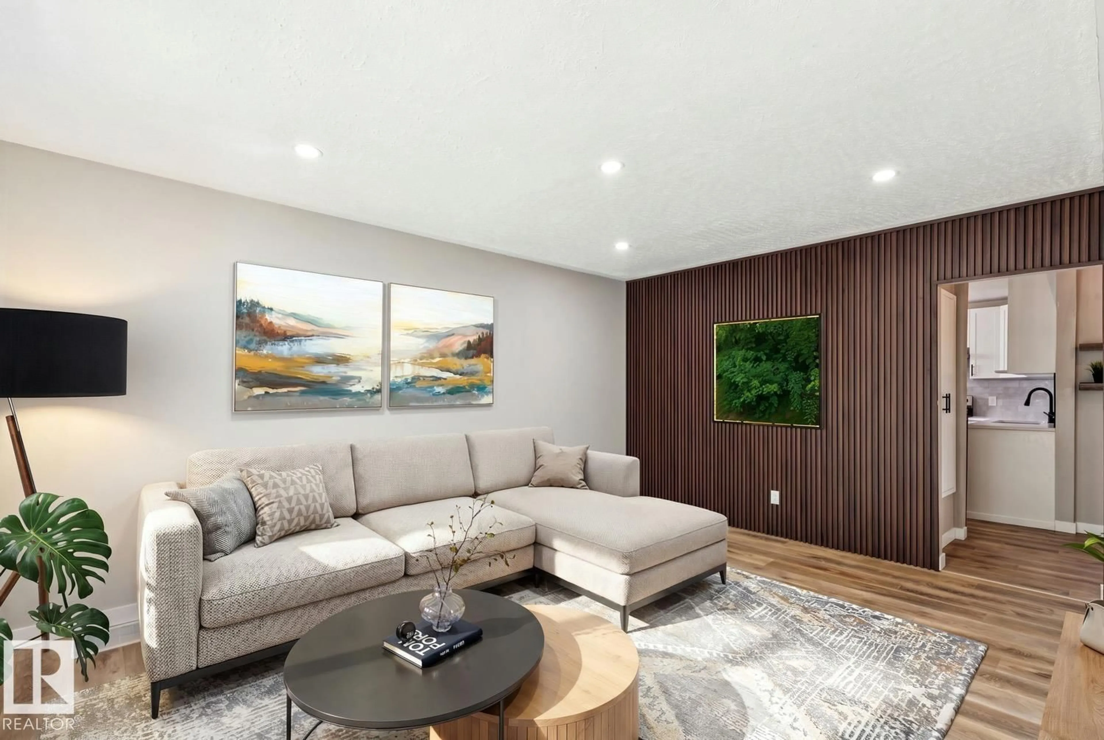 Living room with furniture, wood/laminate floor for 4037 114 AV, Edmonton Alberta T5W0S9