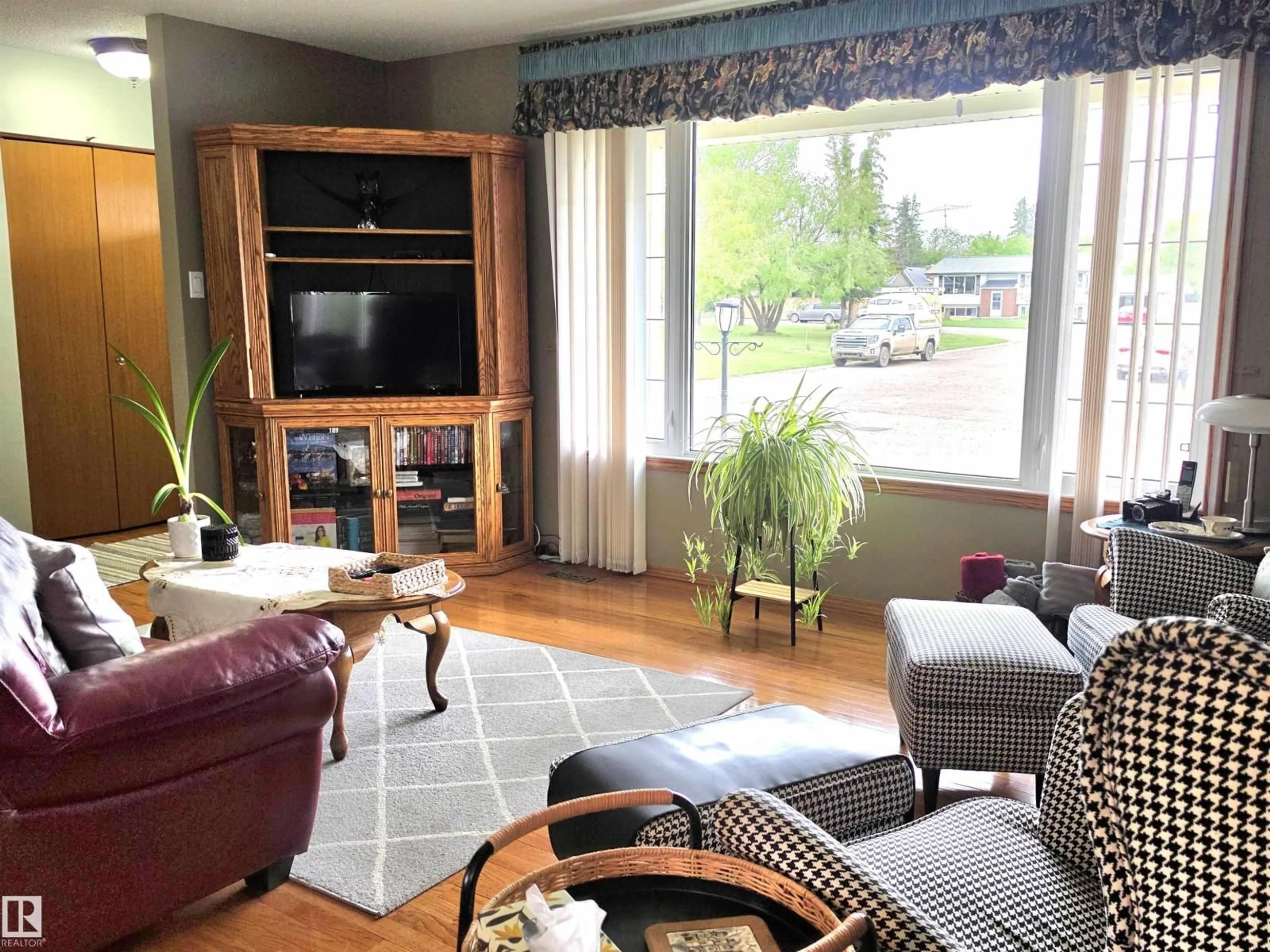 Living room with furniture, wood/laminate floor for 4606 54 AV, Two Hills Alberta T0B4K0