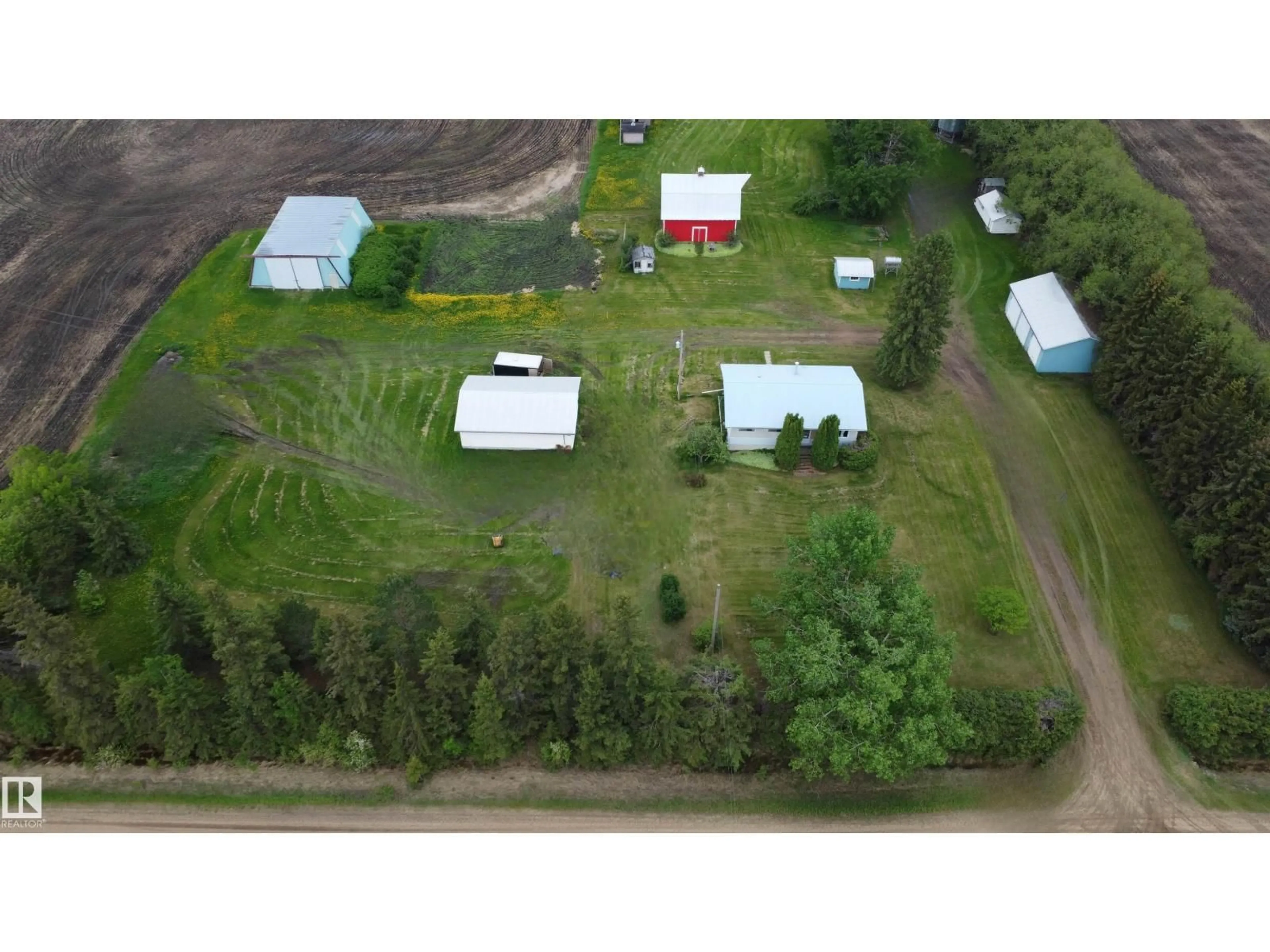 A pic from outside/outdoor area/front of a property/back of a property/a pic from drone, unknown for 2021 TWP RD 604, Rural Westlock County Alberta T7P2N9
