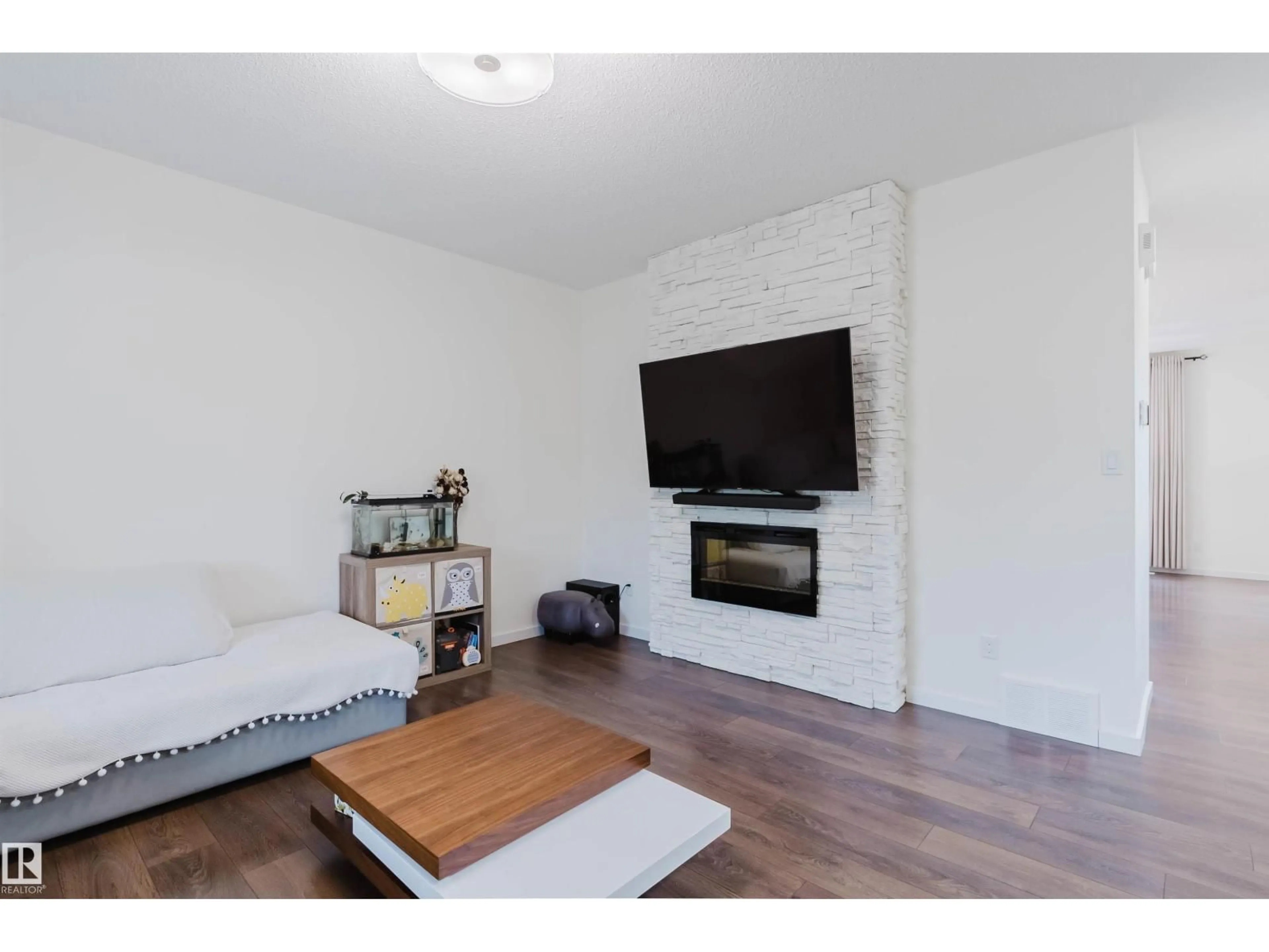 Living room with furniture, wood/laminate floor for 2124 GLENRIDDING WY, Edmonton Alberta T6W2H4