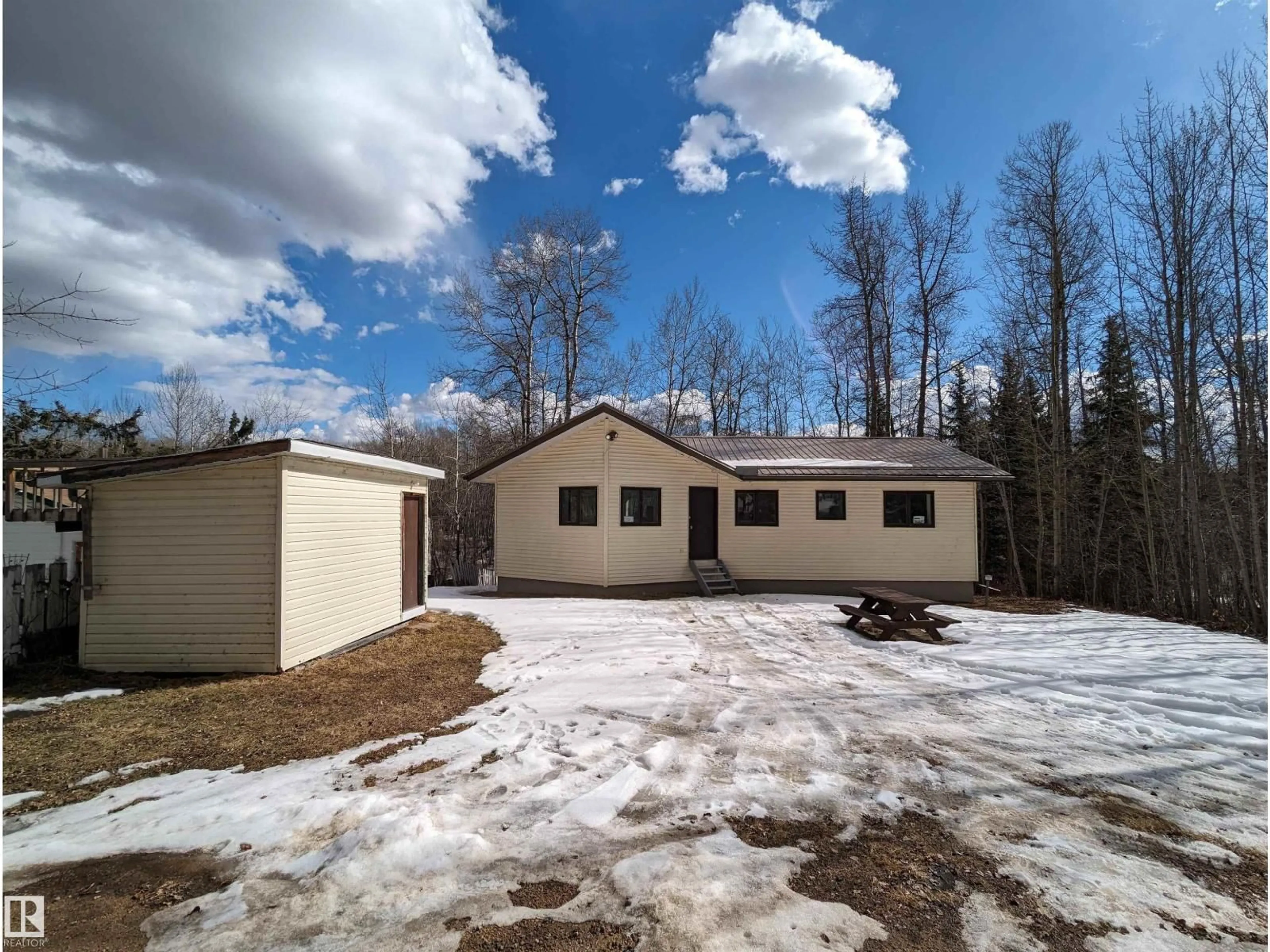 A pic from outside/outdoor area/front of a property/back of a property/a pic from drone, unknown for 163 - 5415 TWP RD 594, Rural Barrhead County Alberta T7N1N2