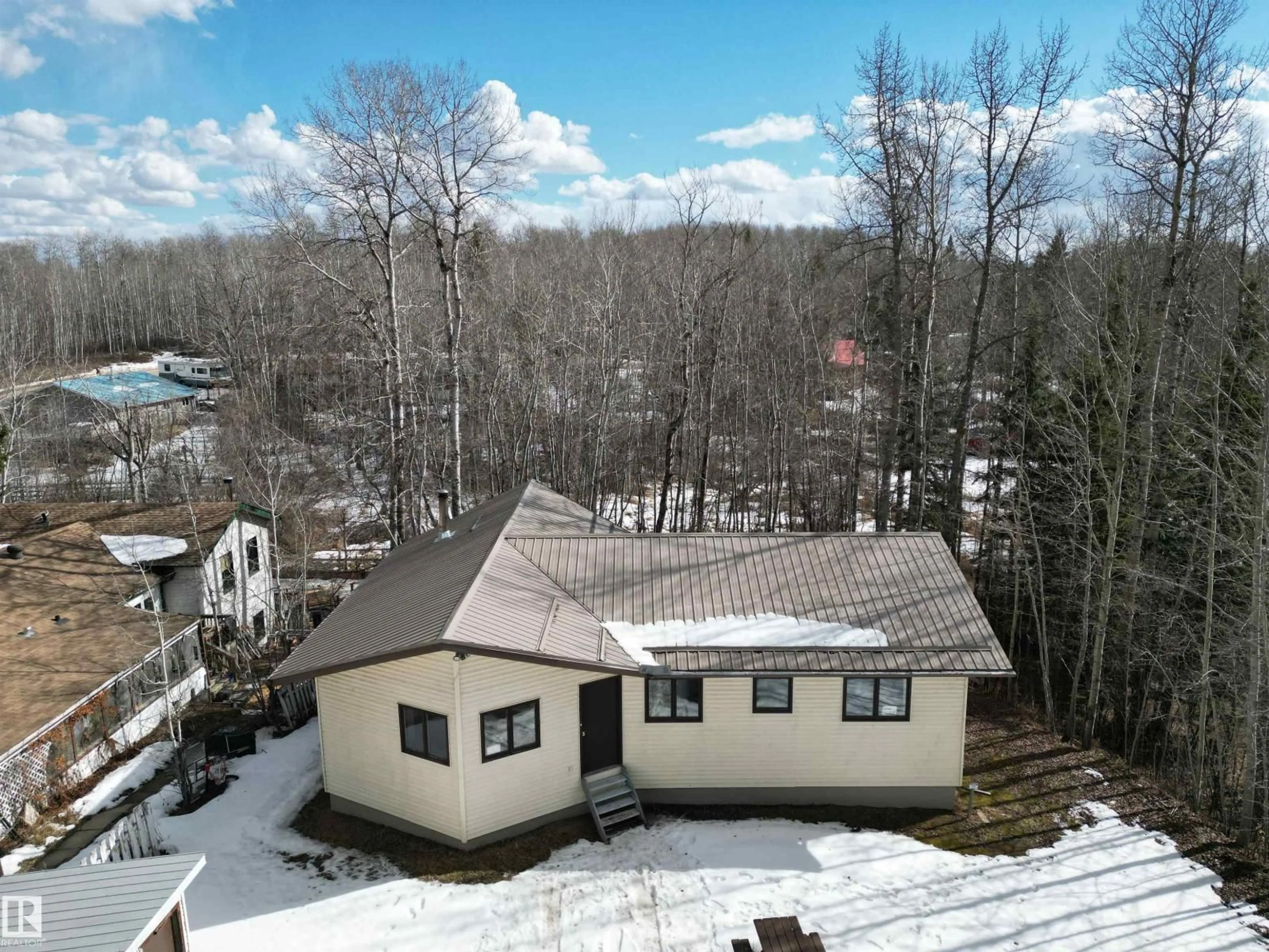 A pic from outside/outdoor area/front of a property/back of a property/a pic from drone, mountain view for 163 - 5415 TWP RD 594, Rural Barrhead County Alberta T7N1N2