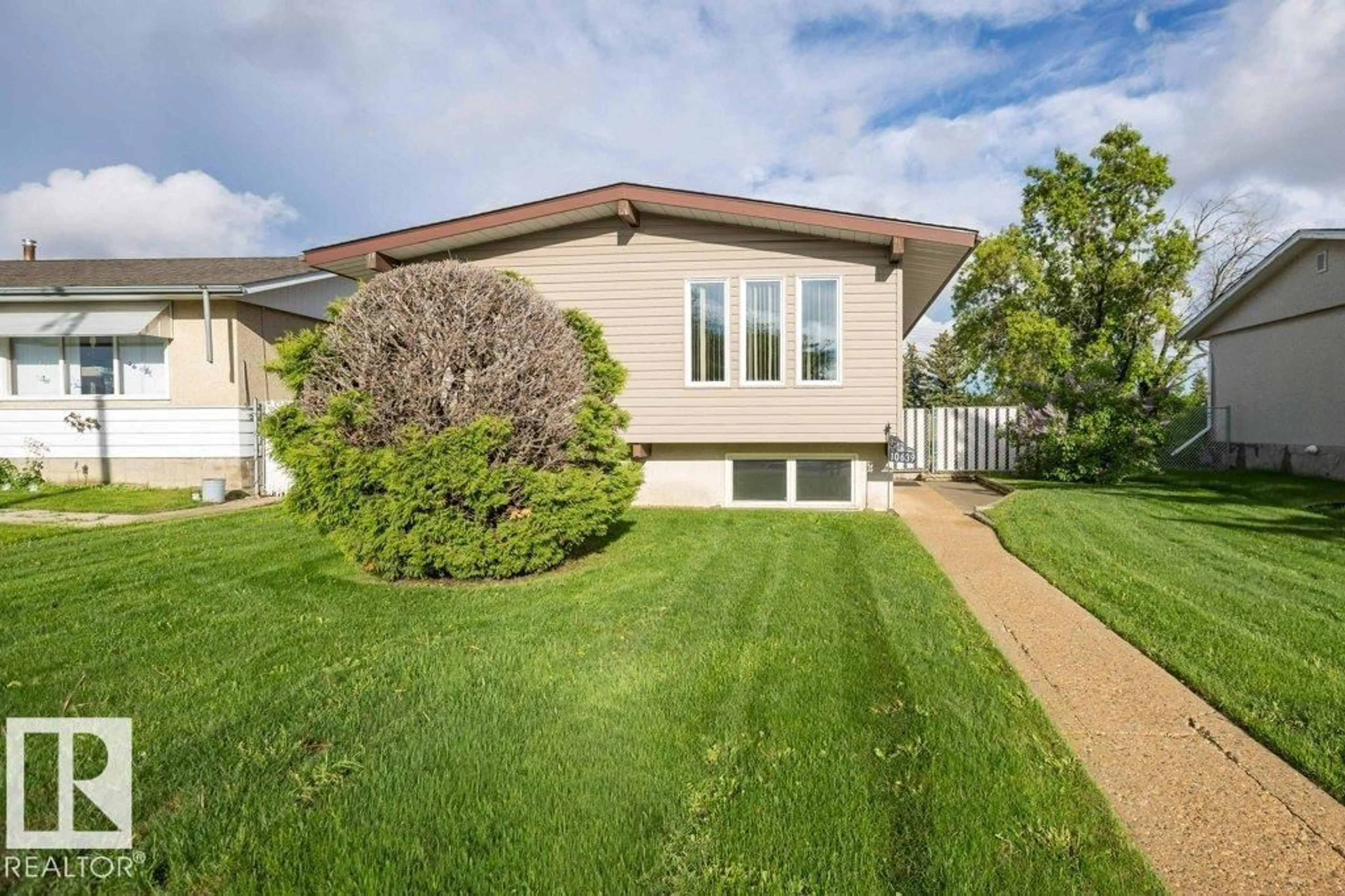 Home with vinyl exterior material, street for 10639 104 ST, Westlock Alberta T7P1L8