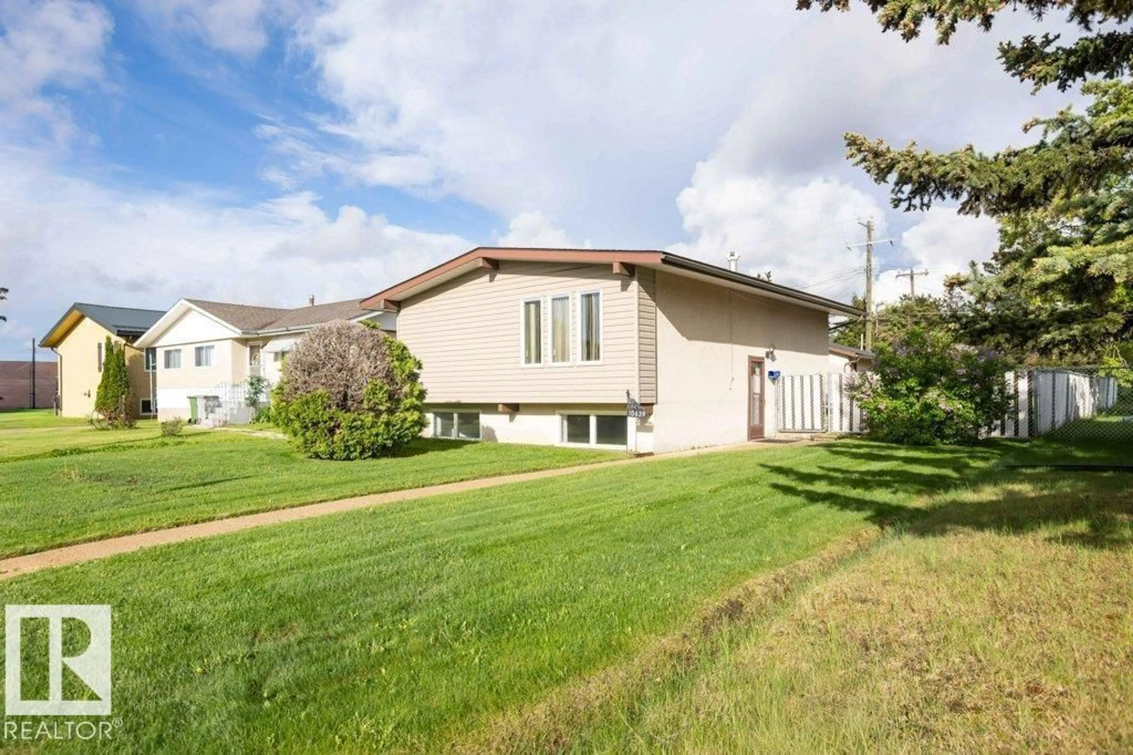 Home with vinyl exterior material, street for 10639 104 ST, Westlock Alberta T7P1L8