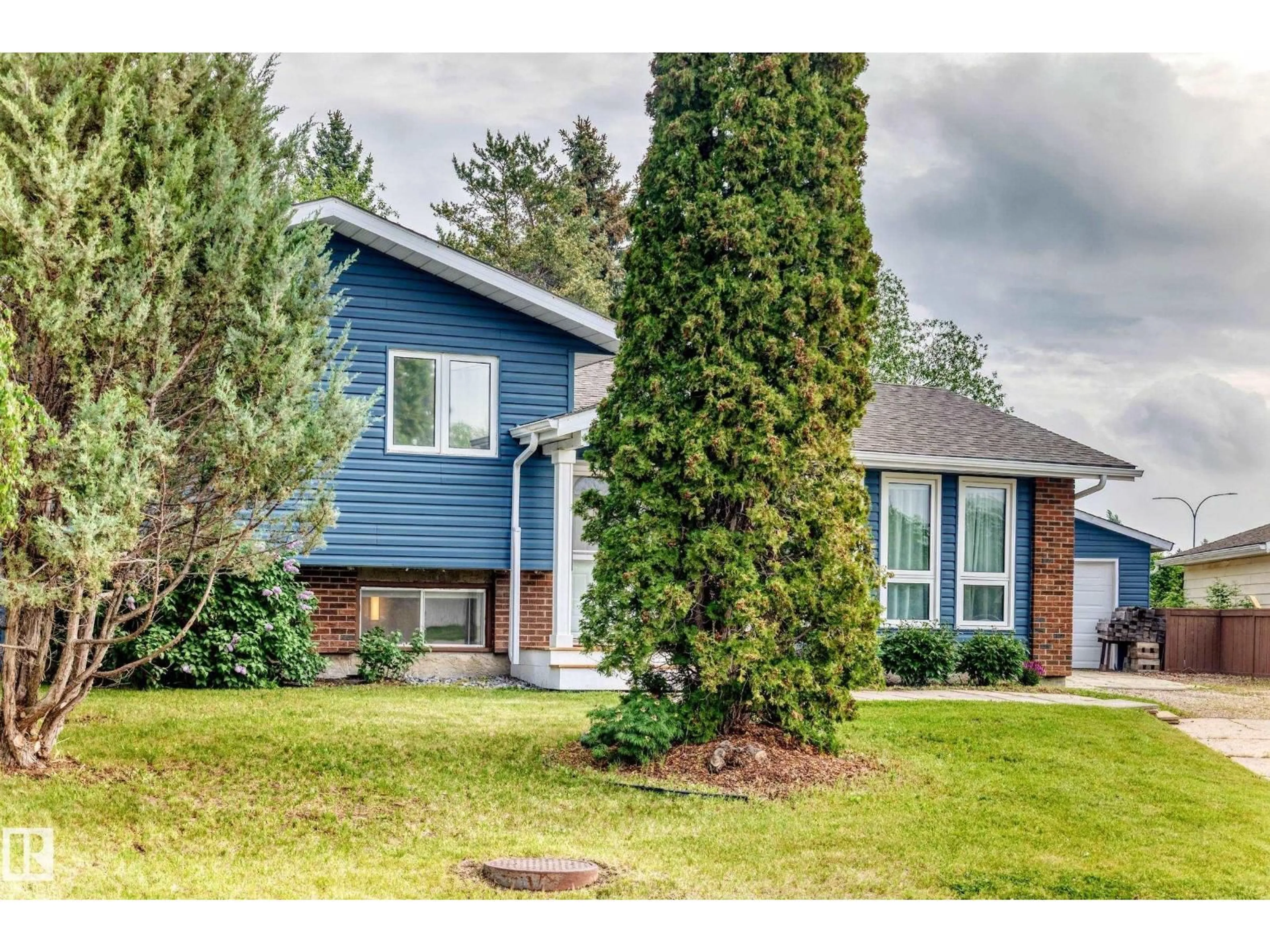 Home with vinyl exterior material, street for 9921 90 ST, Morinville Alberta T8R1K3