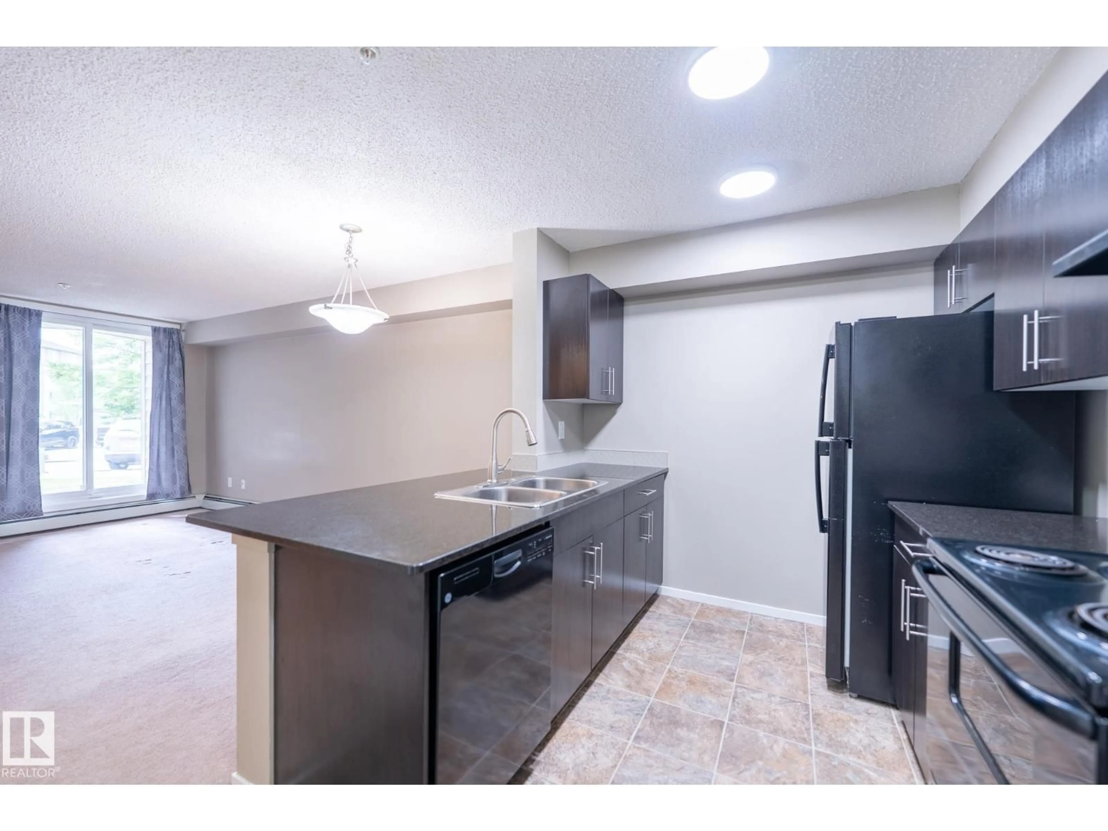 Open concept kitchen, unknown for #108 - 18122 77 ST, Edmonton Alberta T5Z0N7