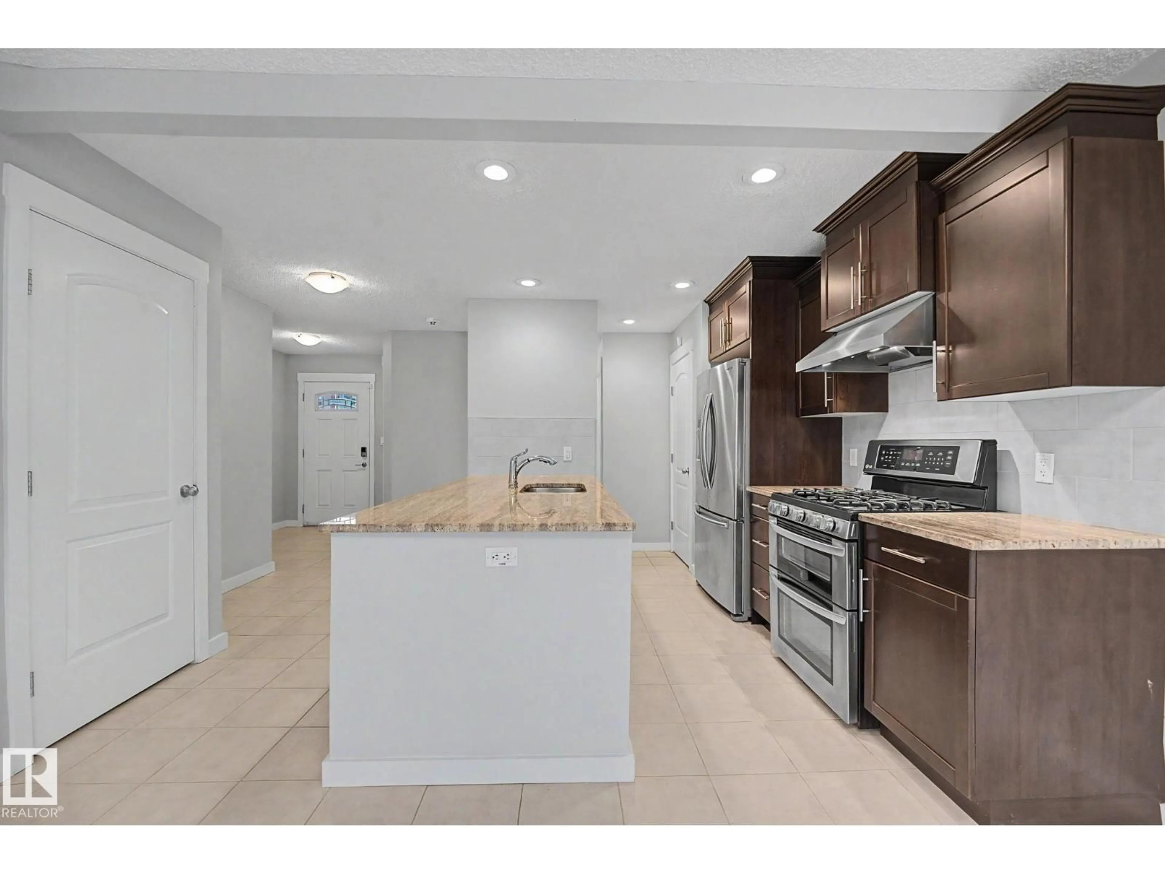 Open concept kitchen, ceramic/tile floor for 16810 53 ST, Edmonton Alberta T5Y0R6