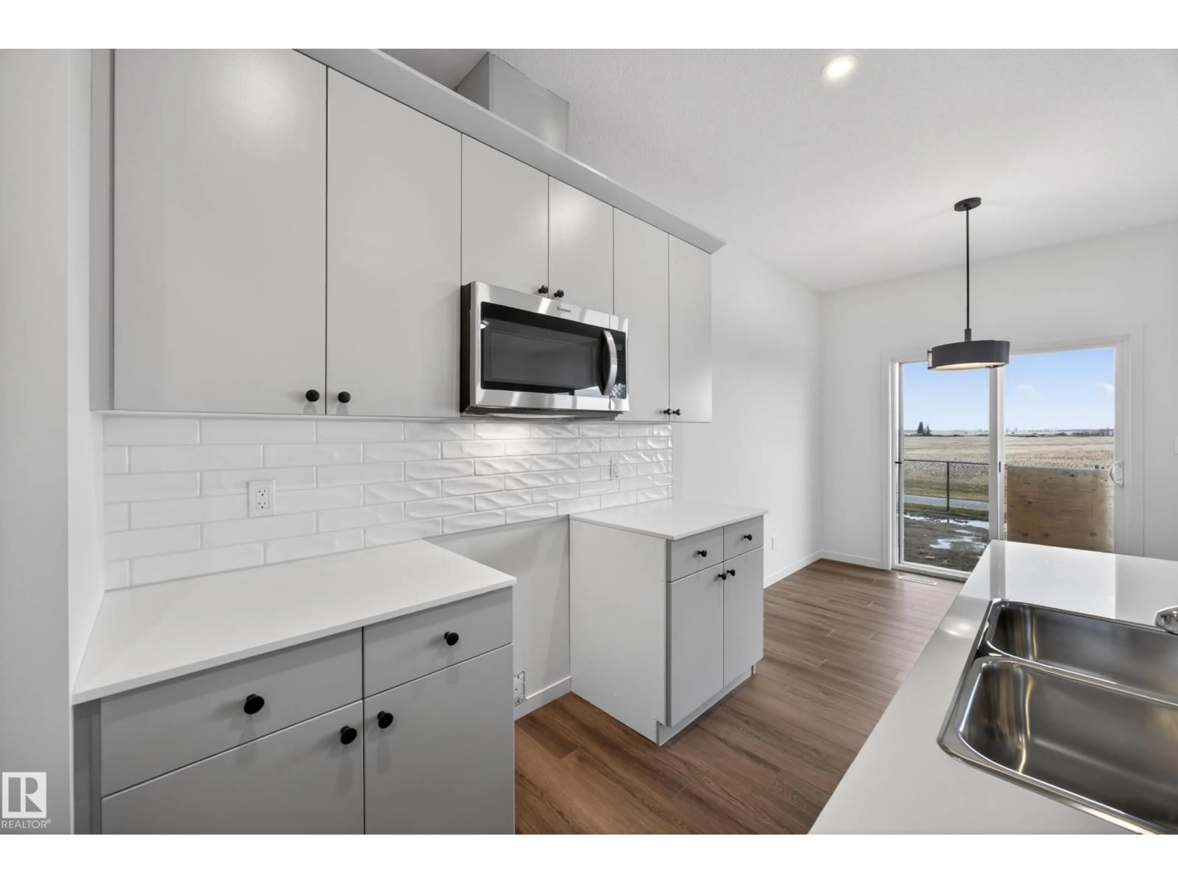 Open concept kitchen, ceramic/tile floor for 116 HONEYSUCKLE GR, Leduc Alberta T9E0V1