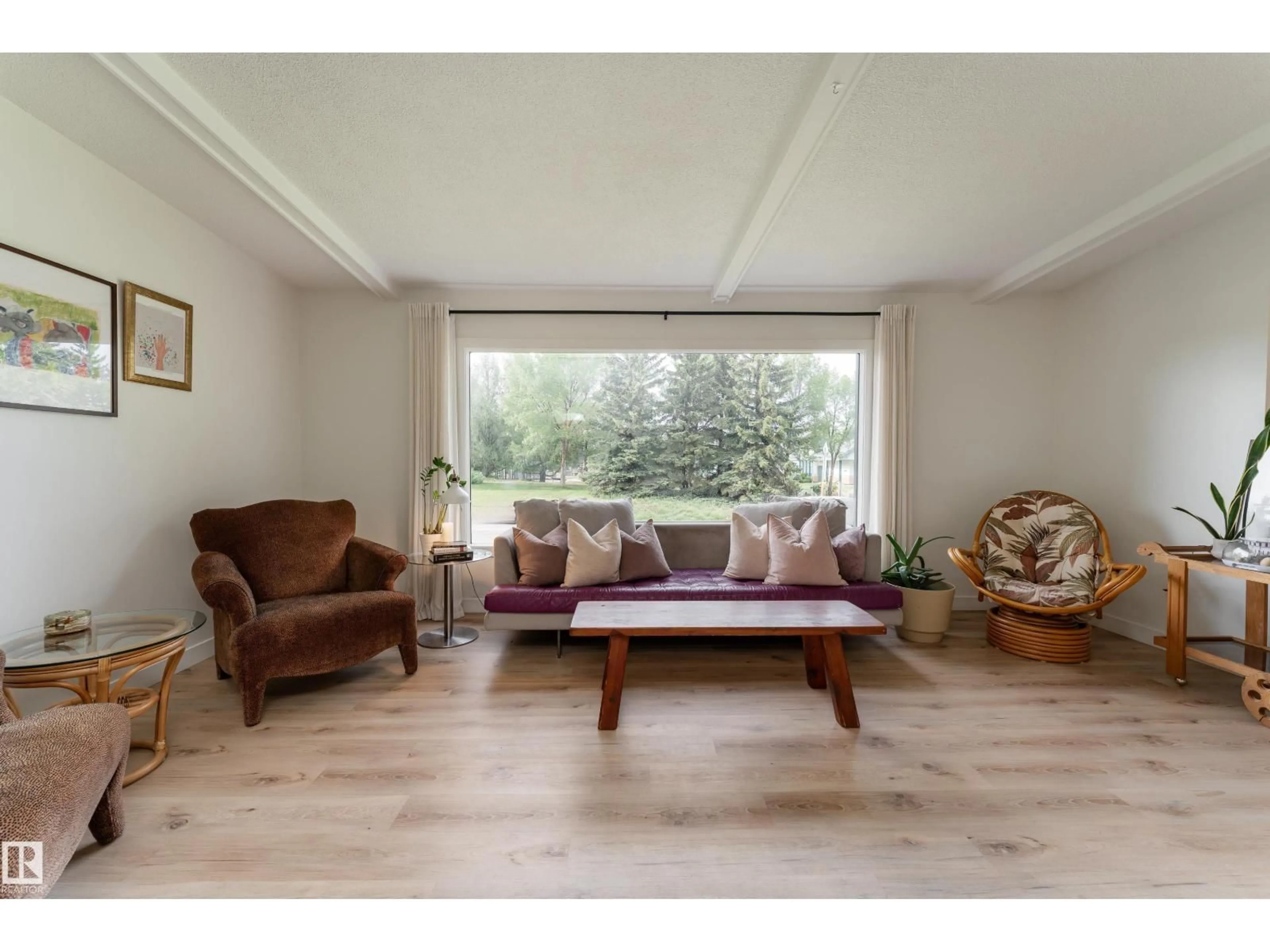 Living room with furniture, wood/laminate floor for 7107 87 AV, Edmonton Alberta T6B0L6