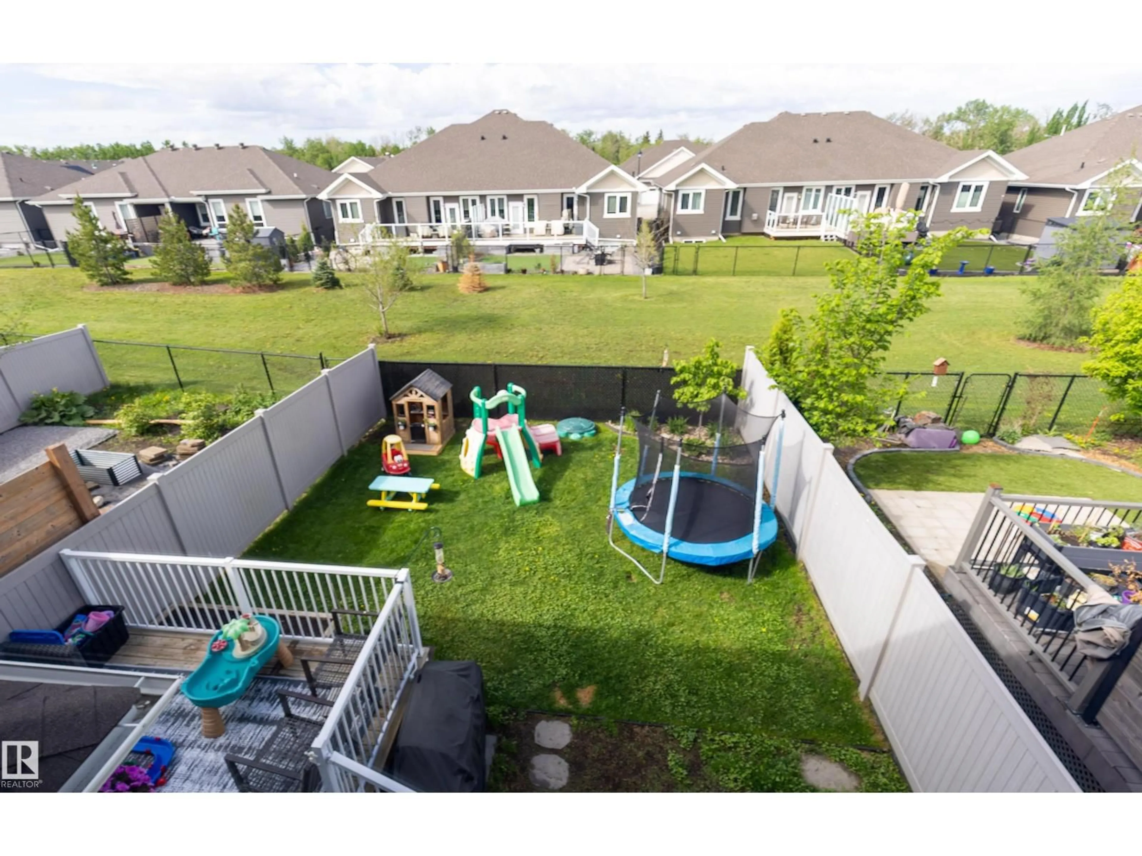 A pic from outside/outdoor area/front of a property/back of a property/a pic from drone, mountain view for 26 RANCHER RD, Ardrossan Alberta T8E0A6