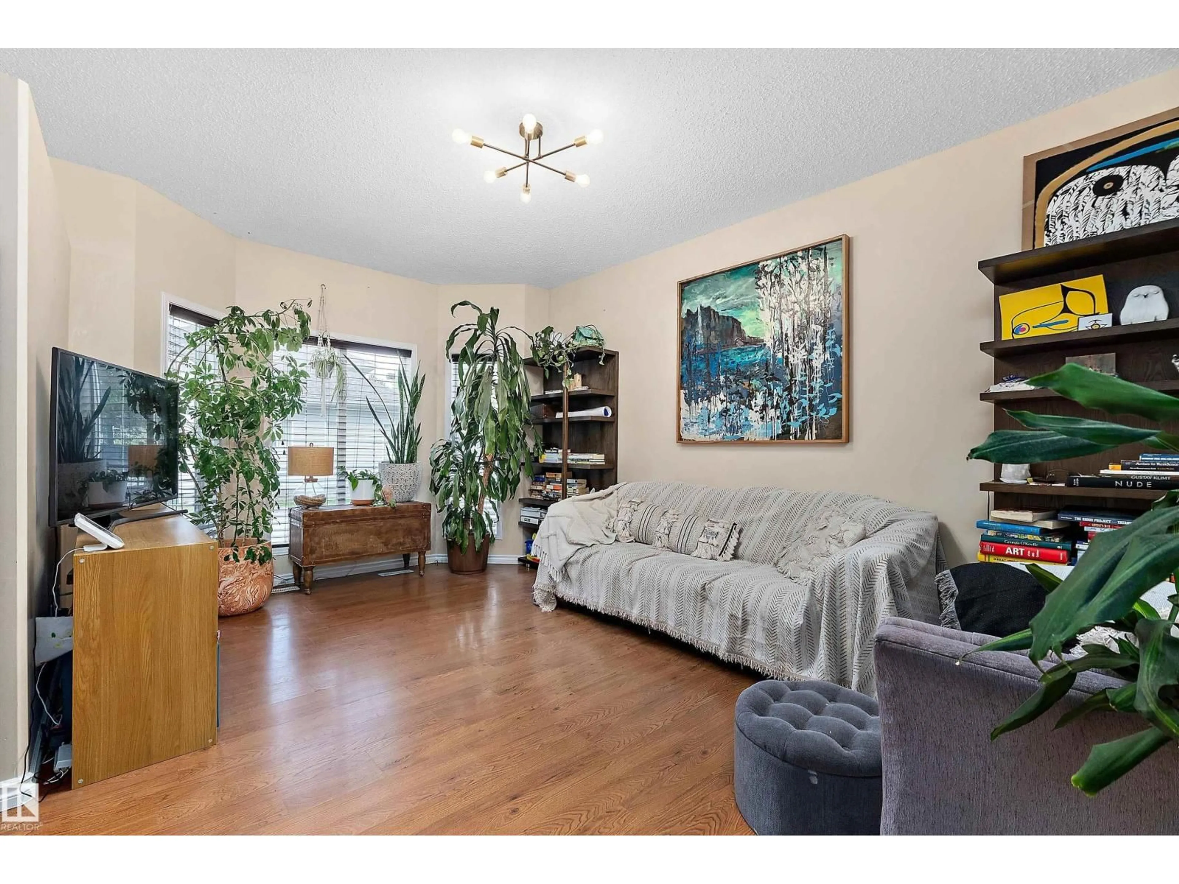 Living room with furniture, wood/laminate floor for 15 - 1780 GLASTONBURY BV, Edmonton Alberta T5T6P9