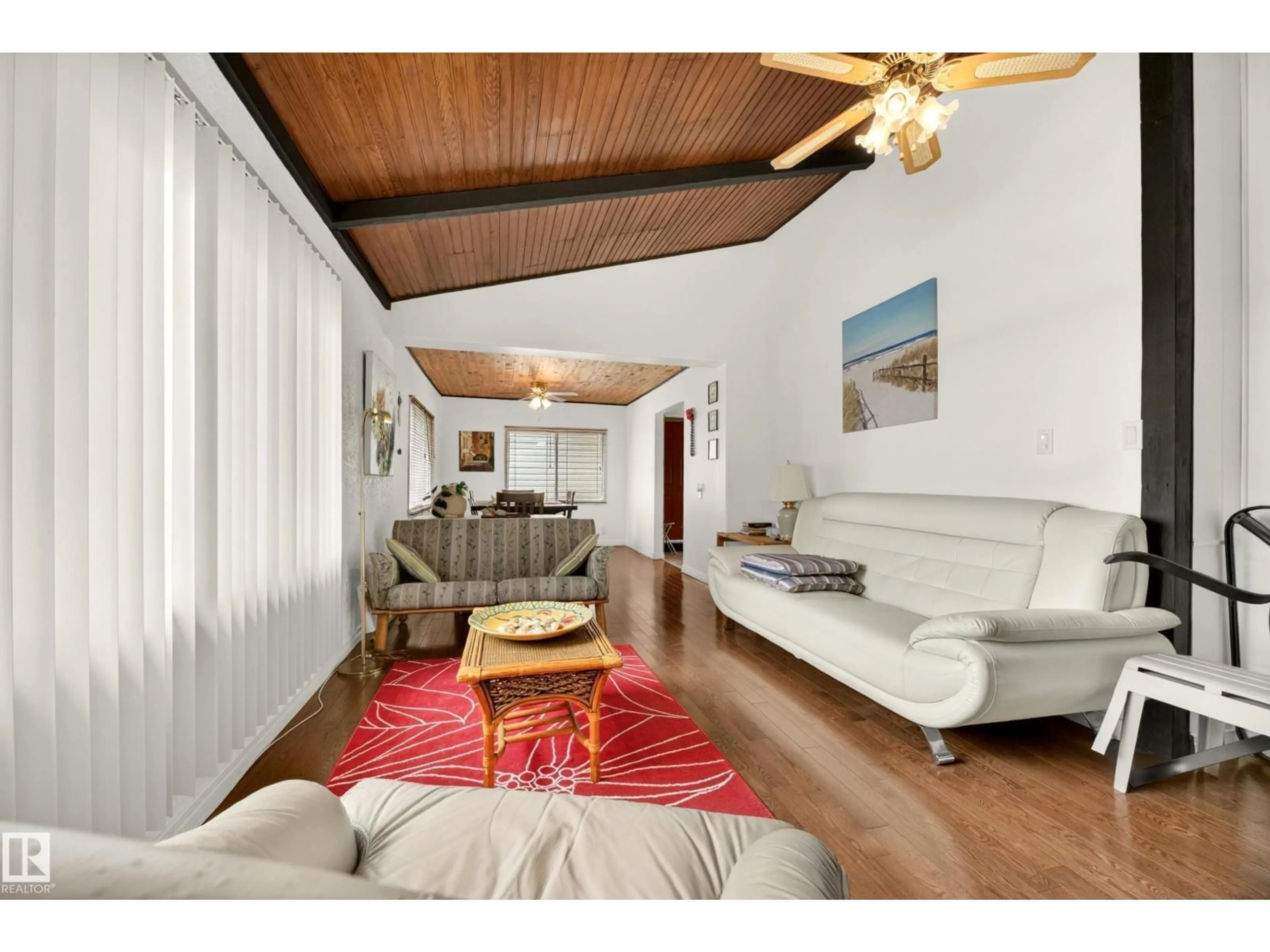 Living room with furniture, wood/laminate floor for 35 - 51263 RG RD 204, Rural Strathcona County Alberta T8E1G9