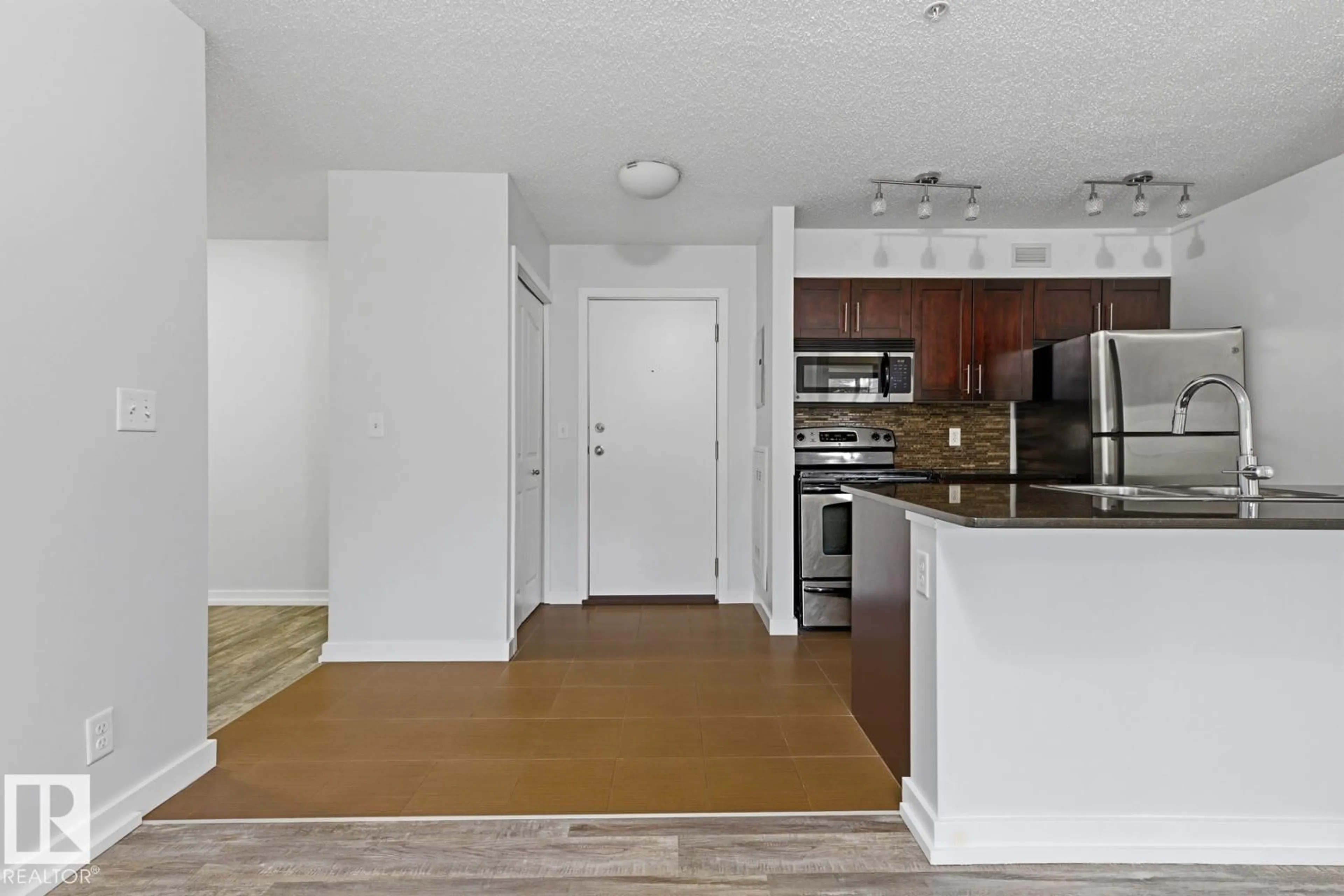 Open concept kitchen, unknown for 534 - 110 WATT BV, Edmonton Alberta T6X1P7