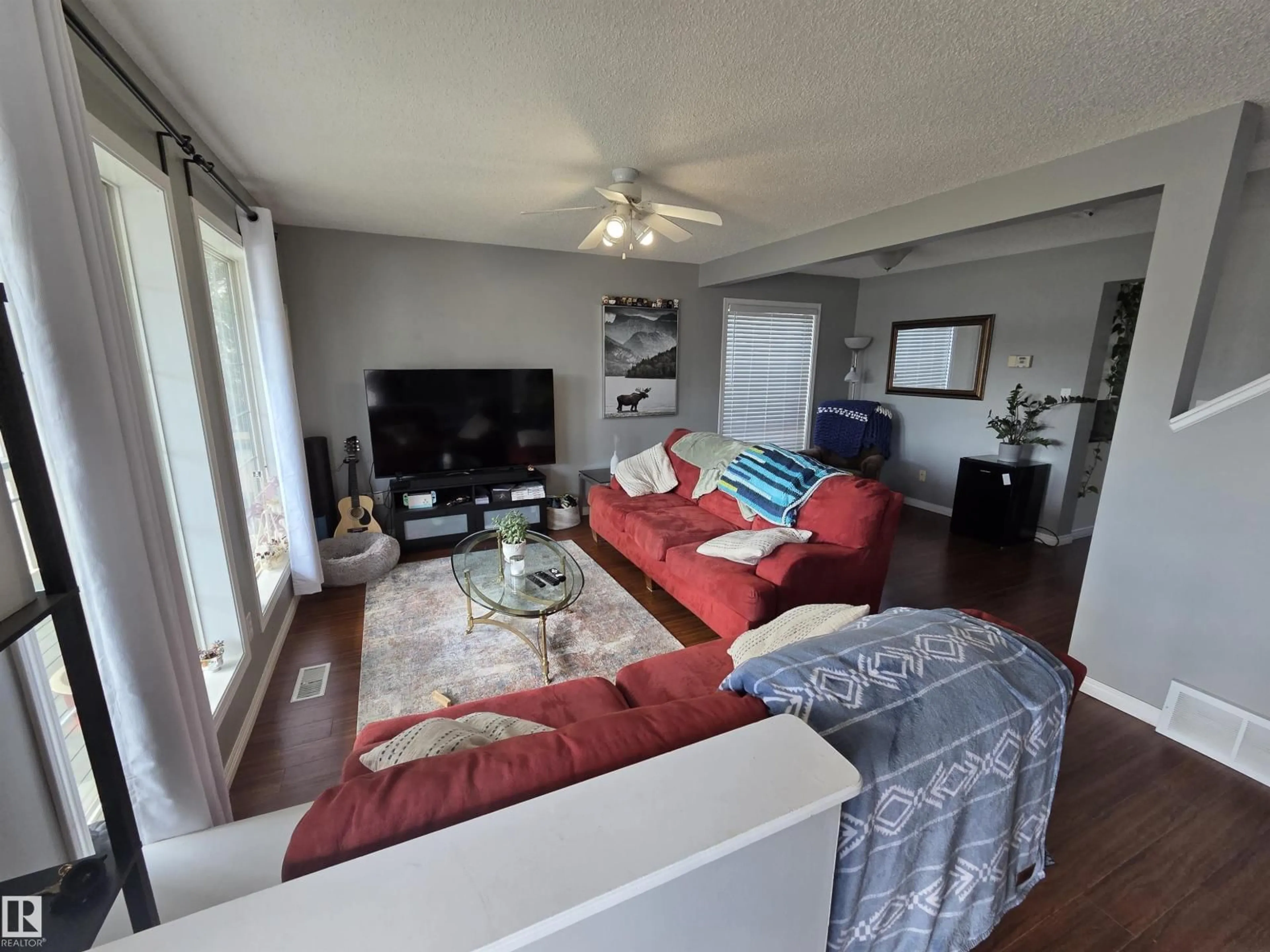 Living room with furniture, wood/laminate floor for 919 NORMANDY LN, Sherwood Park Alberta T8A5X7
