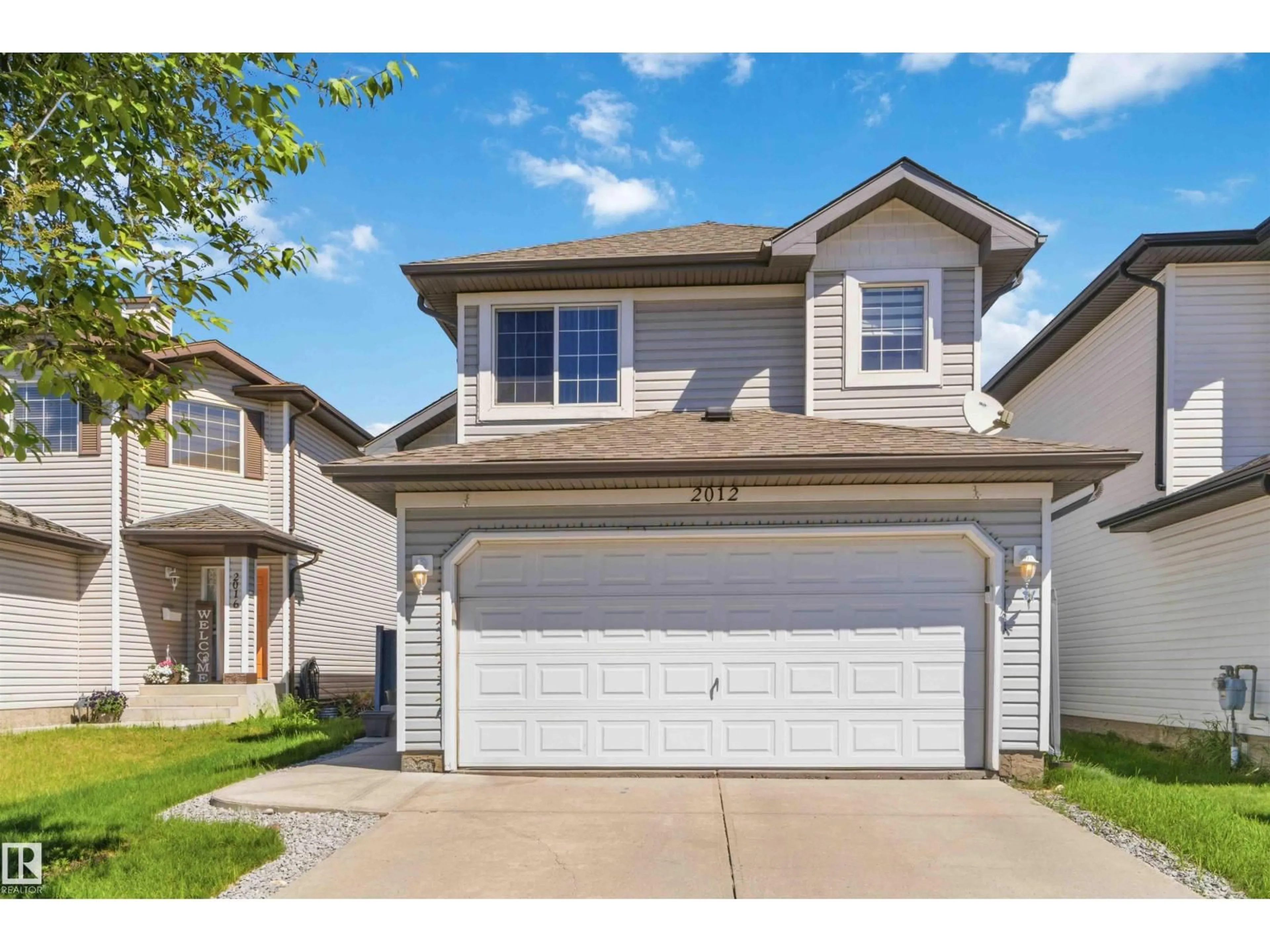 Home with vinyl exterior material, street for 2012 35A AV, Edmonton Alberta T6T1Y2