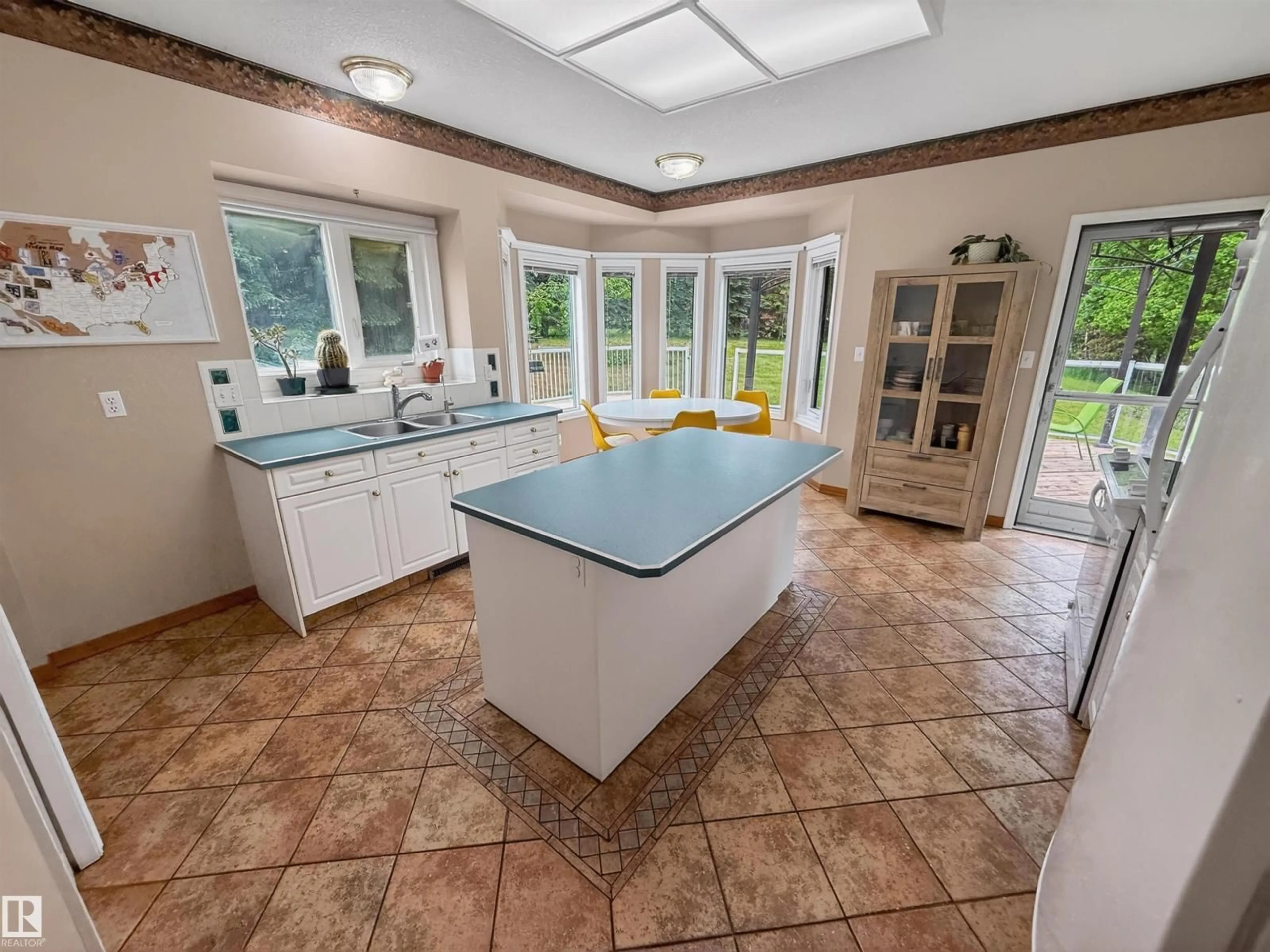 Open concept kitchen, ceramic/tile floor for 11922 226 ST, Edmonton Alberta T5S2C2