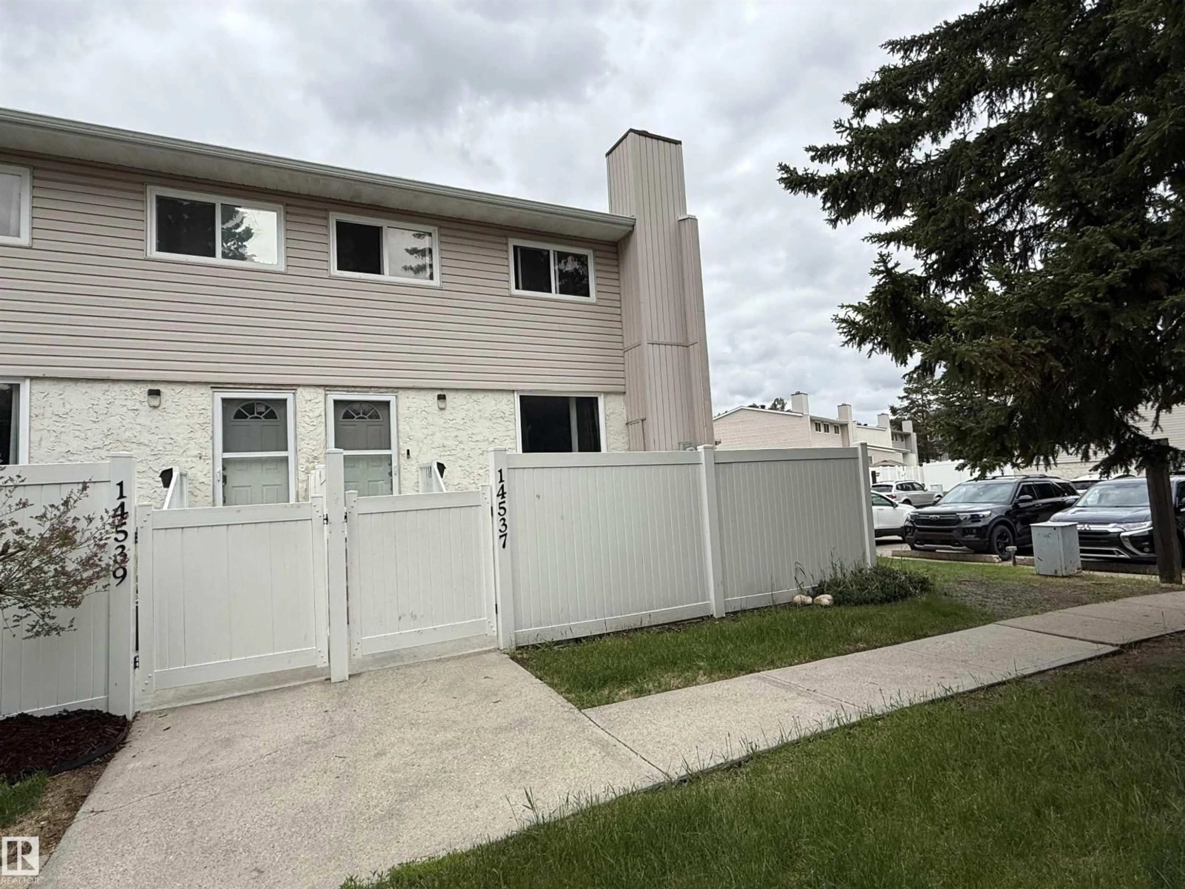 Home with vinyl exterior material, street for 14537 121 ST, Edmonton Alberta T5X2S2